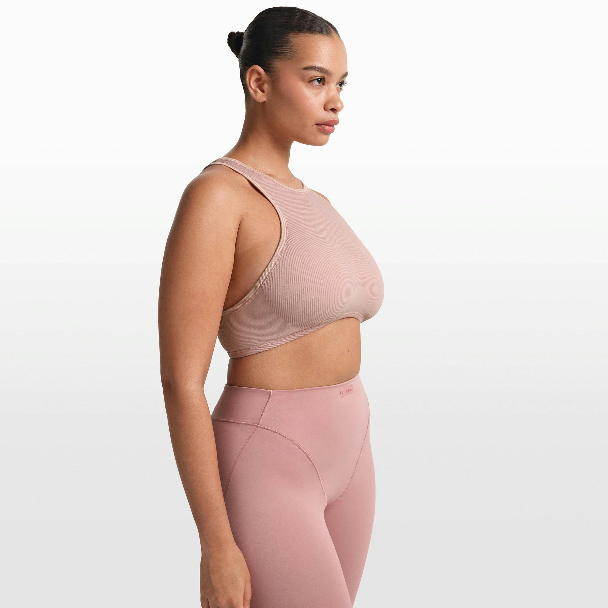 NikeSKIMS RIBBED SEAMLESS RACER FRONT BRA | HIMALAYAN ON A MODEL FRONT VIEW @ | FOCUS: 0.0, 1.0, 0.9