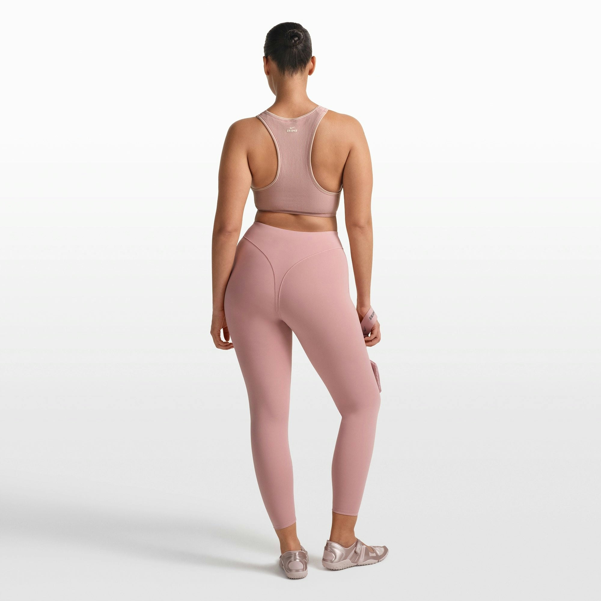 NikeSKIMS RIBBED SEAMLESS RACER FRONT BRA | HIMALAYAN ON A MODEL FRONT VIEW @ | FOCUS: 0.0, 1.0, 0.9