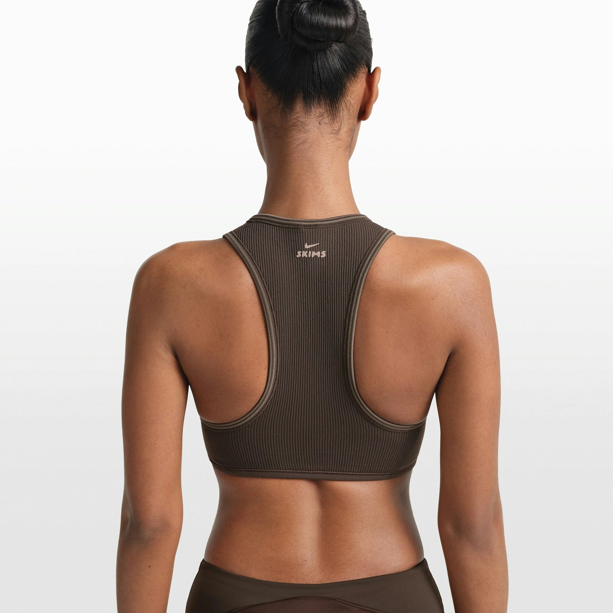 NikeSKIMS RIBBED SEAMLESS RACER FRONT BRA | PHOENIX/TRUFFLE ON A MODEL FRONT VIEW @ | FOCUS: 0.0, 1.0, 0.9