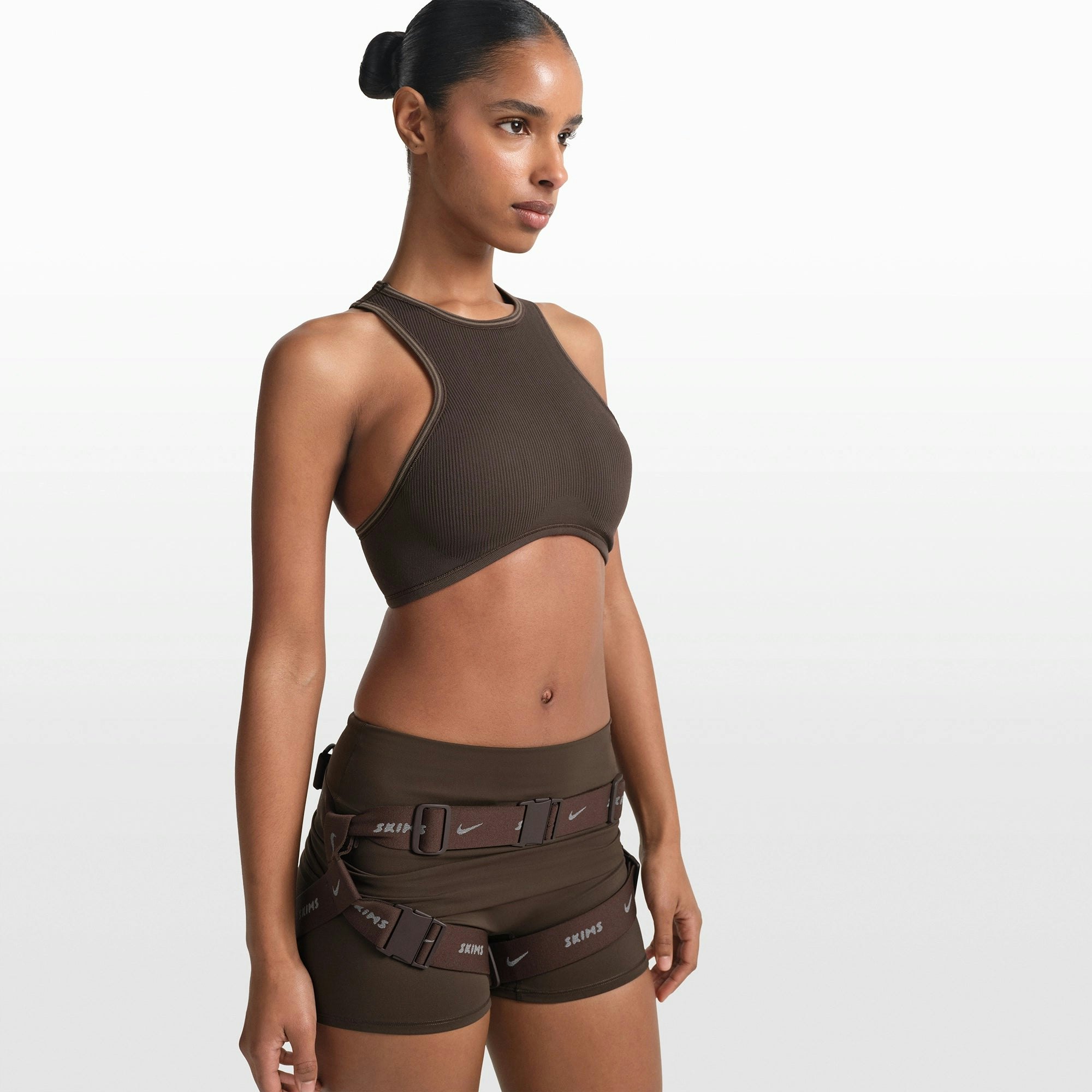 NikeSKIMS RIBBED SEAMLESS RACER FRONT BRA | PHOENIX/TRUFFLE ON A MODEL FRONT VIEW @ | FOCUS: 0.0, 1.0, 0.9