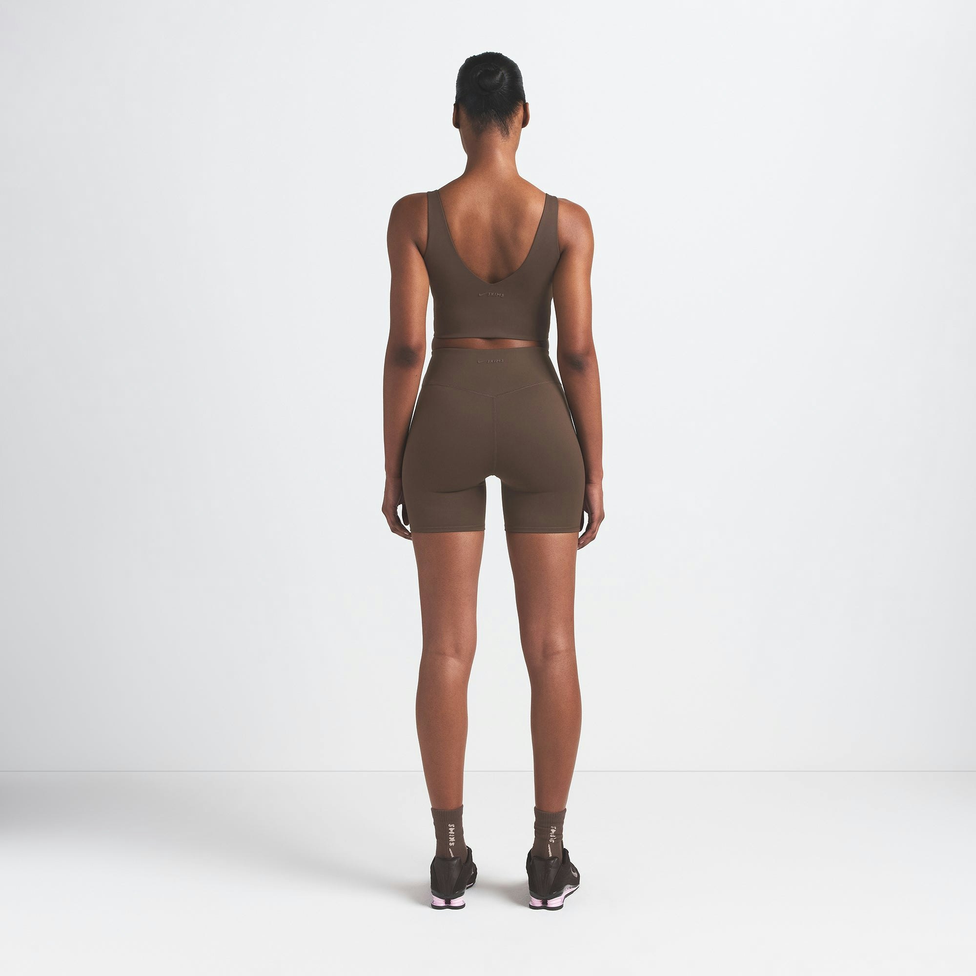 NikeSKIMS MATTE V-NECK BRA TOP | DARK SEPIA ON A MODEL BACK VIEW