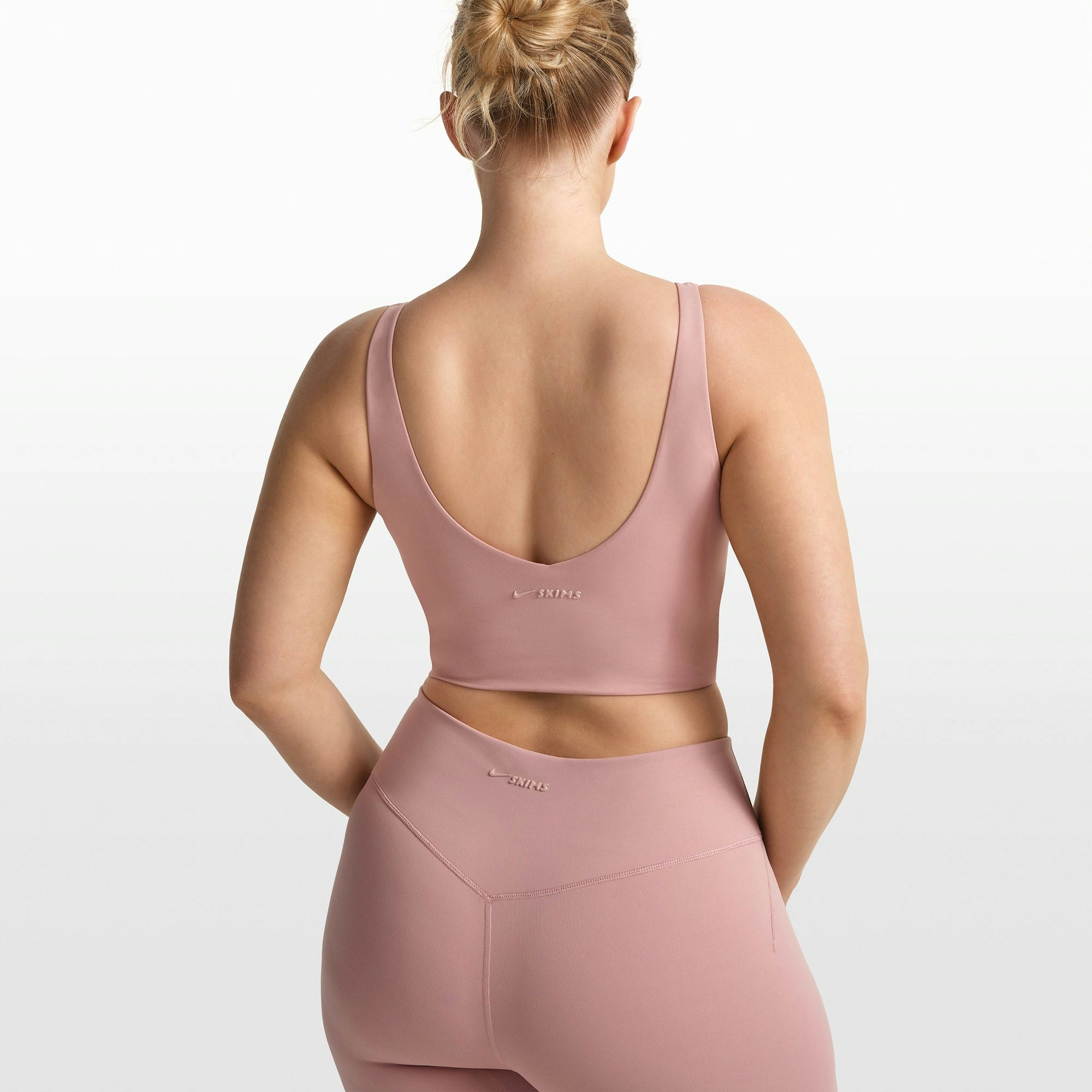 NikeSKIMS MATTE V-NECK BRA TOP | HIMALAYAN ON A MODEL FRONT VIEW @ | FOCUS: 0.0, 1.0, 0.9