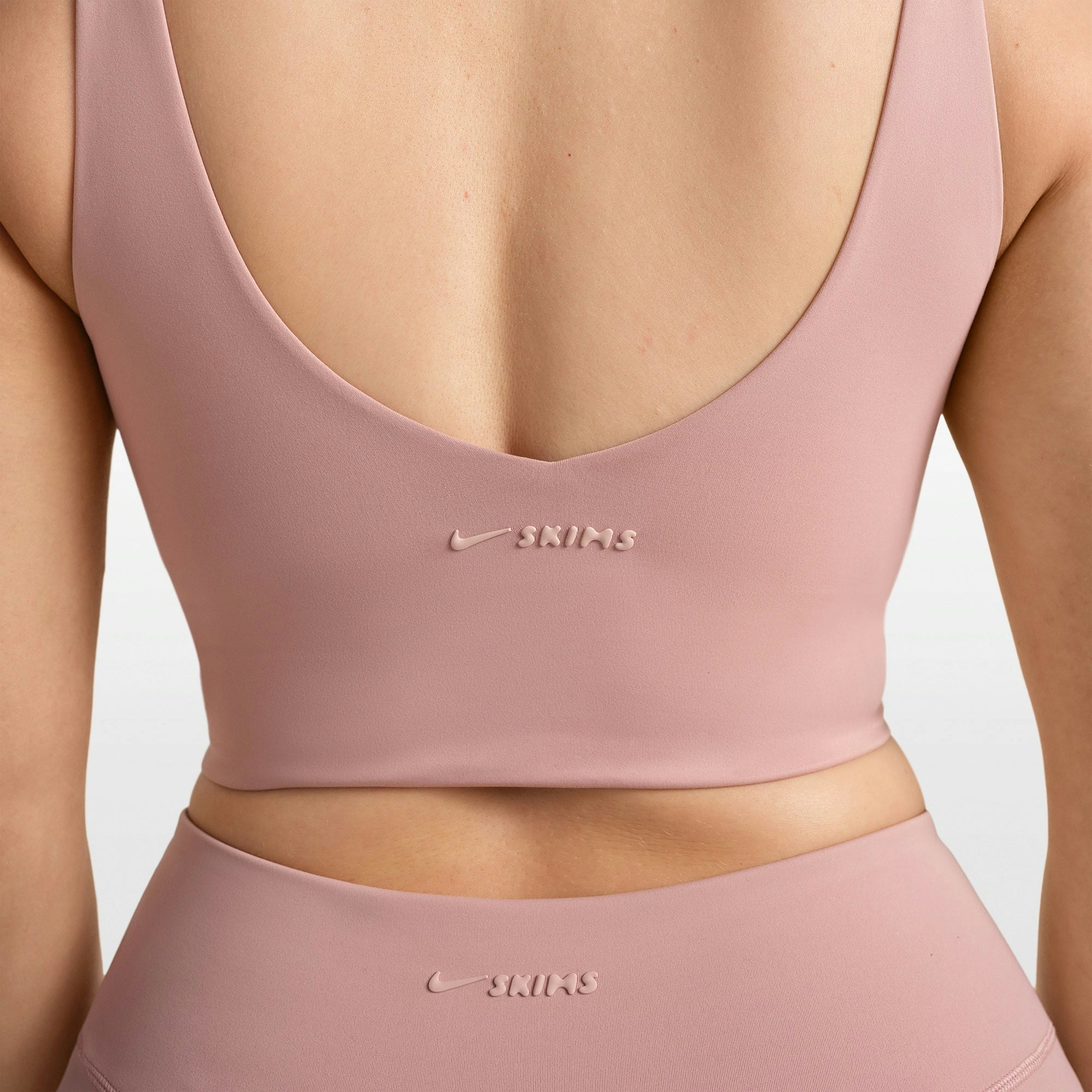 NikeSKIMS MATTE V-NECK BRA TOP | HIMALAYAN ON A MODEL FRONT VIEW @ | FOCUS: 0.0, 1.0, 0.9
