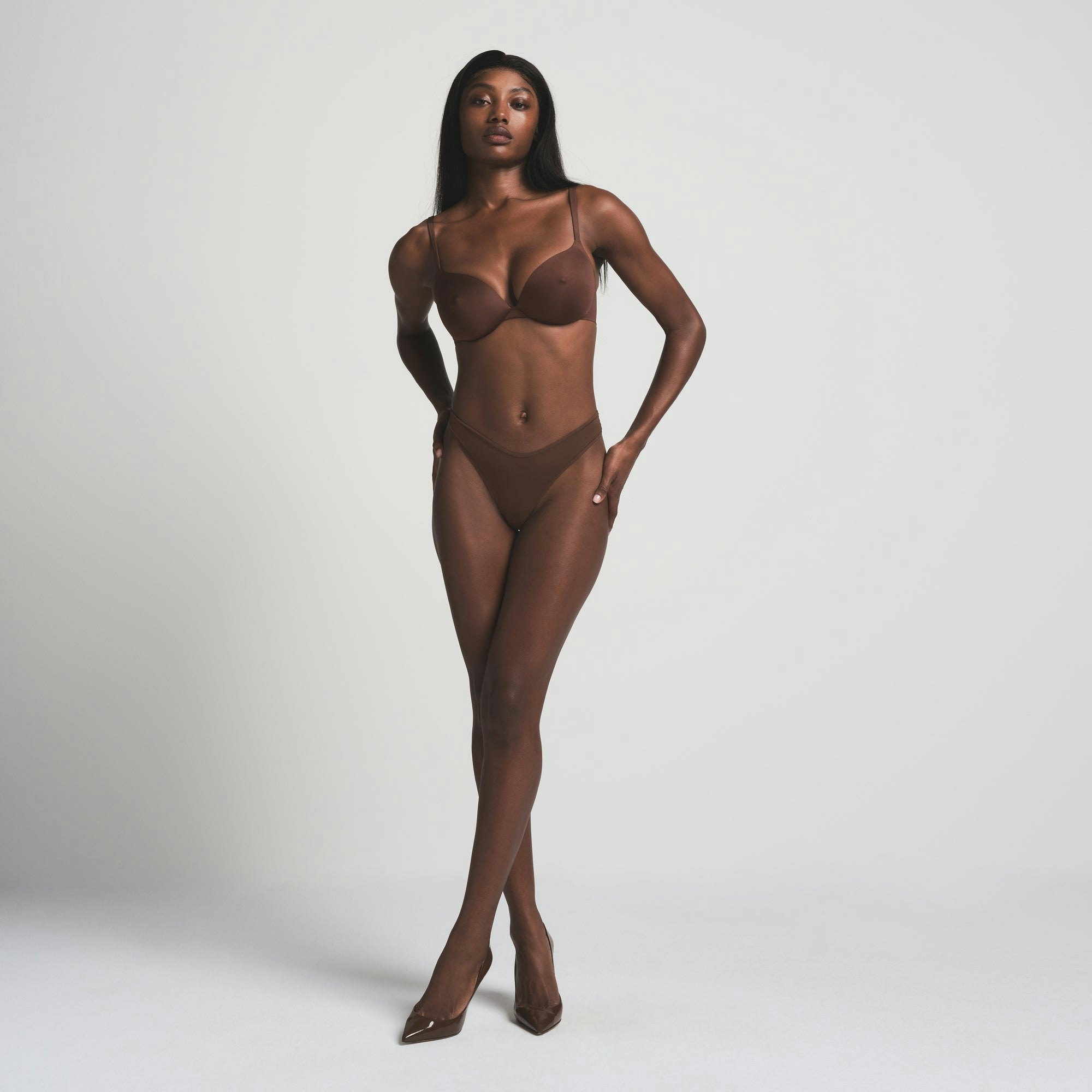 SKIMS ULTIMATE NIPPLE BRA IN COCOA ON A MODEL FRONT VIEW | FOCUS: 0.0, 1.0, 0.9