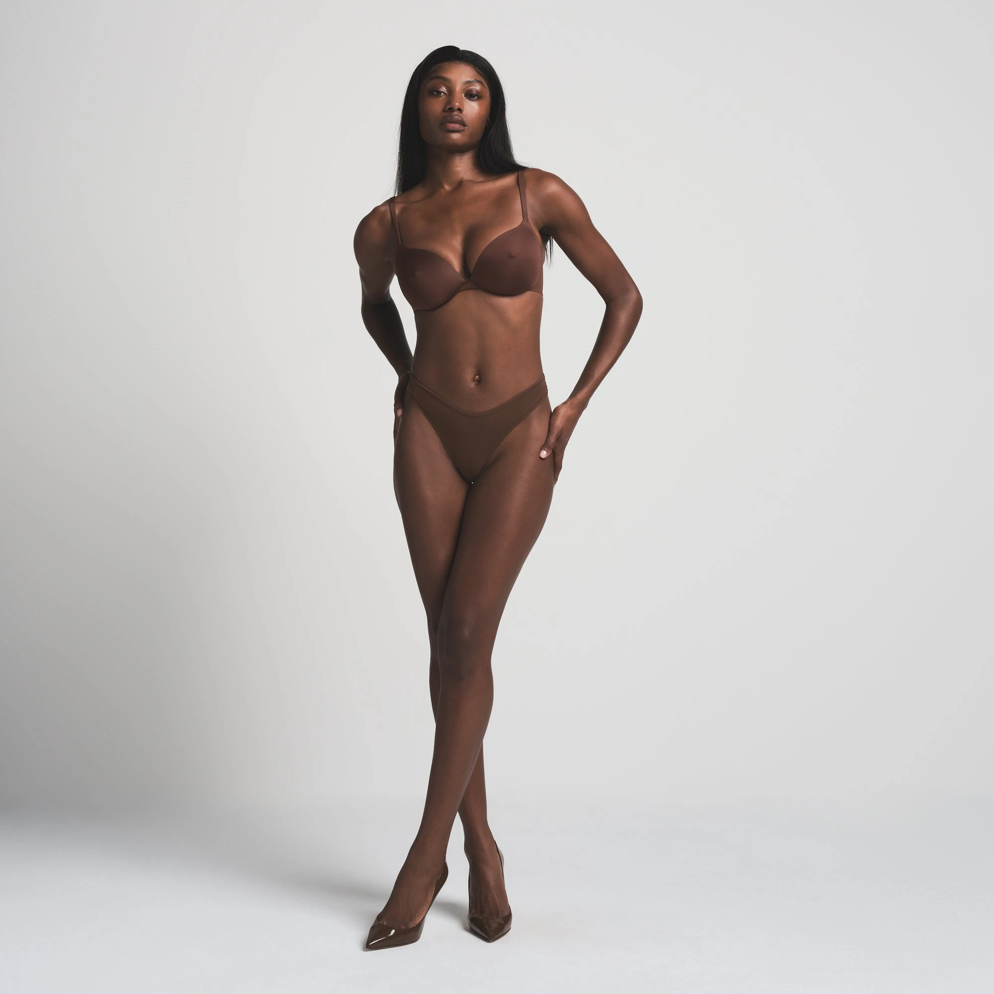 SKIMS ULTIMATE NIPPLE BRA IN COCOA ON A MODEL FRONT VIEW | FOCUS: 0.0, 1.0, 0.9