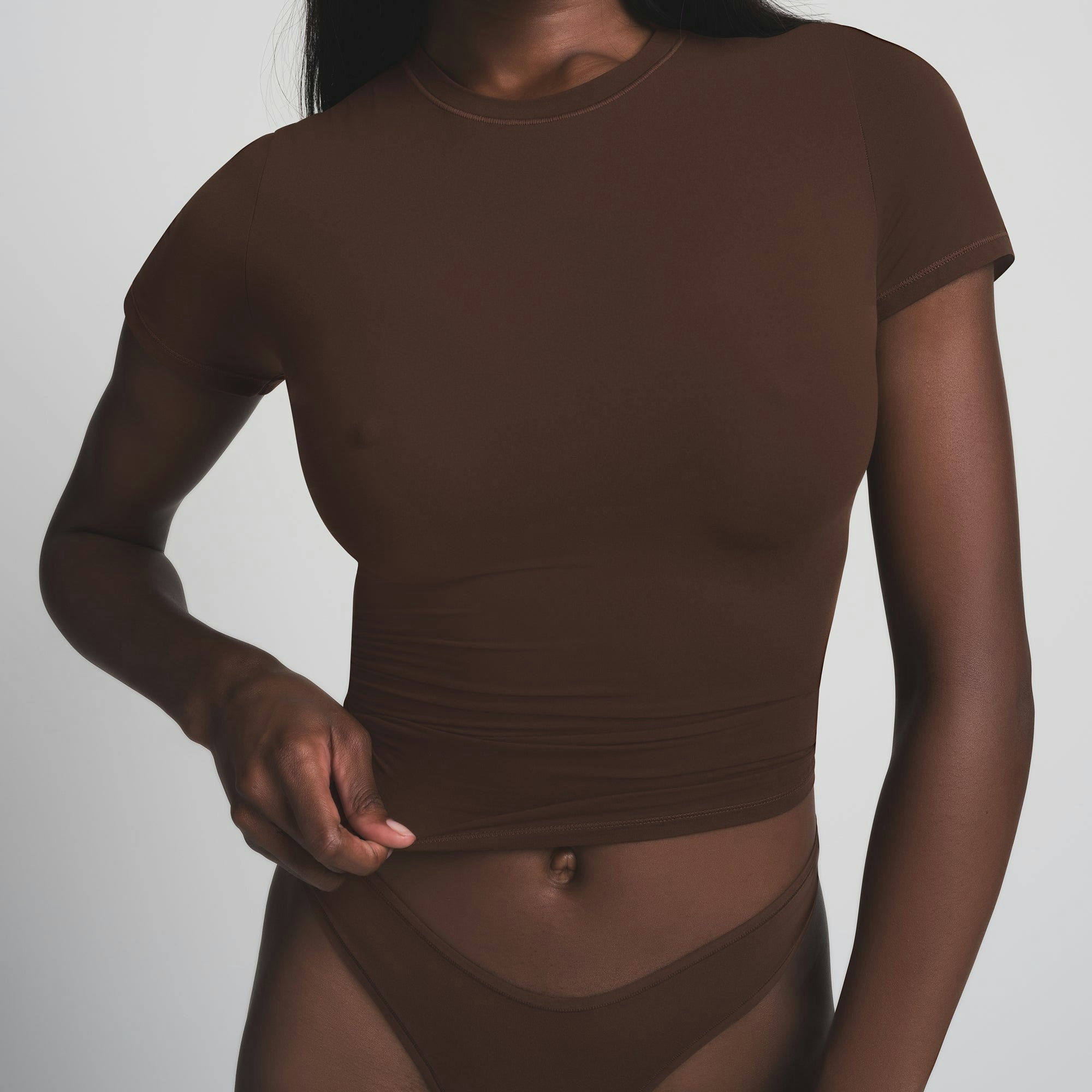 SKIMS ULTIMATE NIPPLE BRA IN COCOA ON A MODEL FRONT VIEW | FOCUS: 0.0, 1.0, 0.9