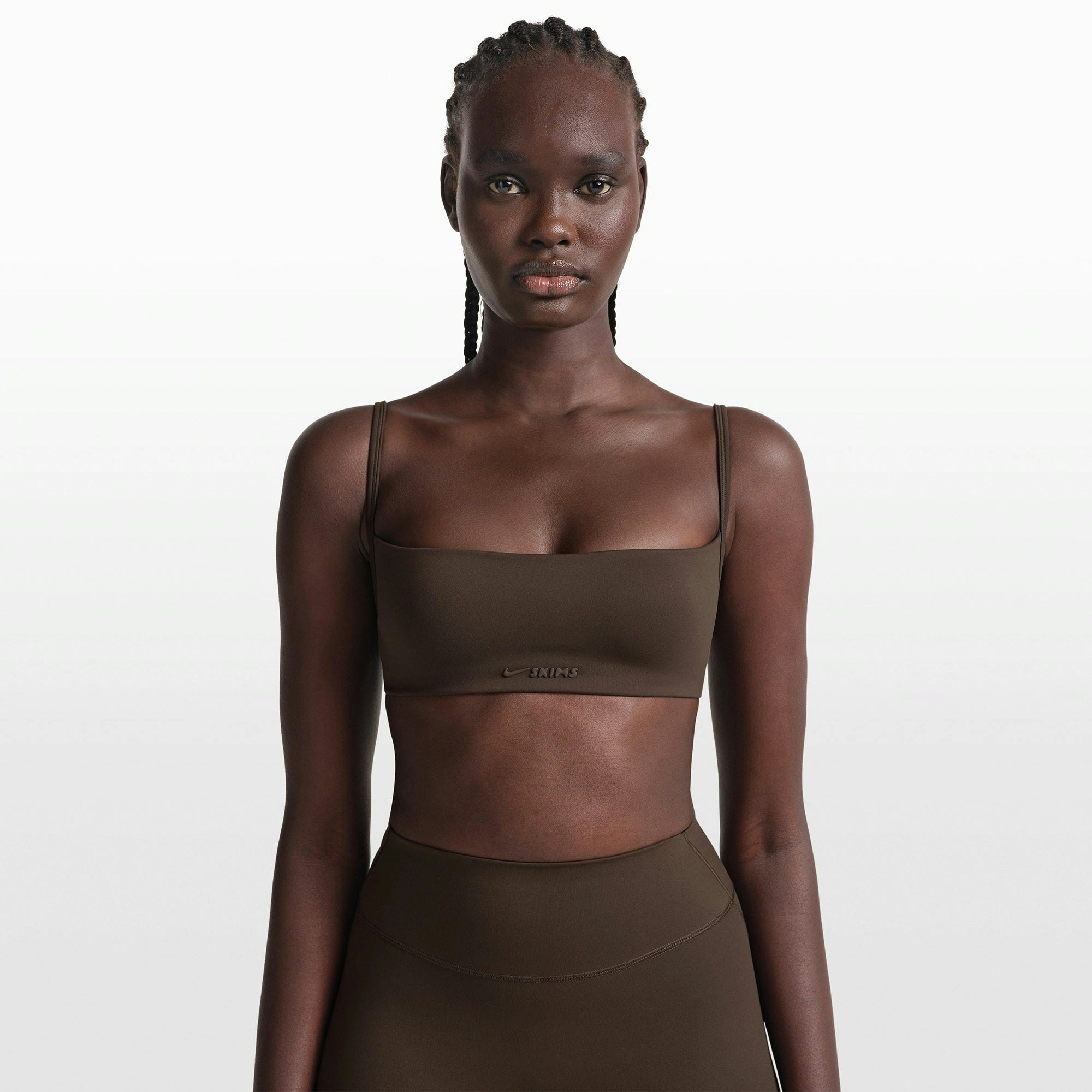 NikeSKIMS MATTE MICRO BRA | DARK SEPIA ON A MODEL FRONT VIEW @ | FOCUS: 0.0, 1.0, 0.9
