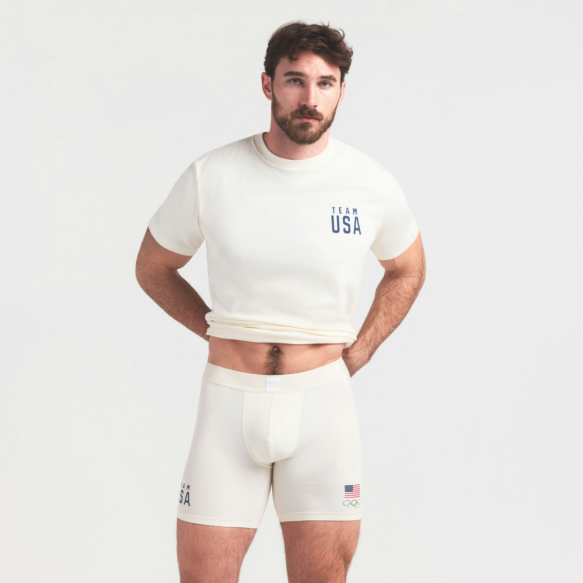 SKIMS FOR TEAM USA SKIMS COTTON MENS OLYMPIC 5 INCH BOXER BRIEF | ECRU ON A MODEL SIDE VIEW @ | FOCUS: 0.0, 1.0, 0.9