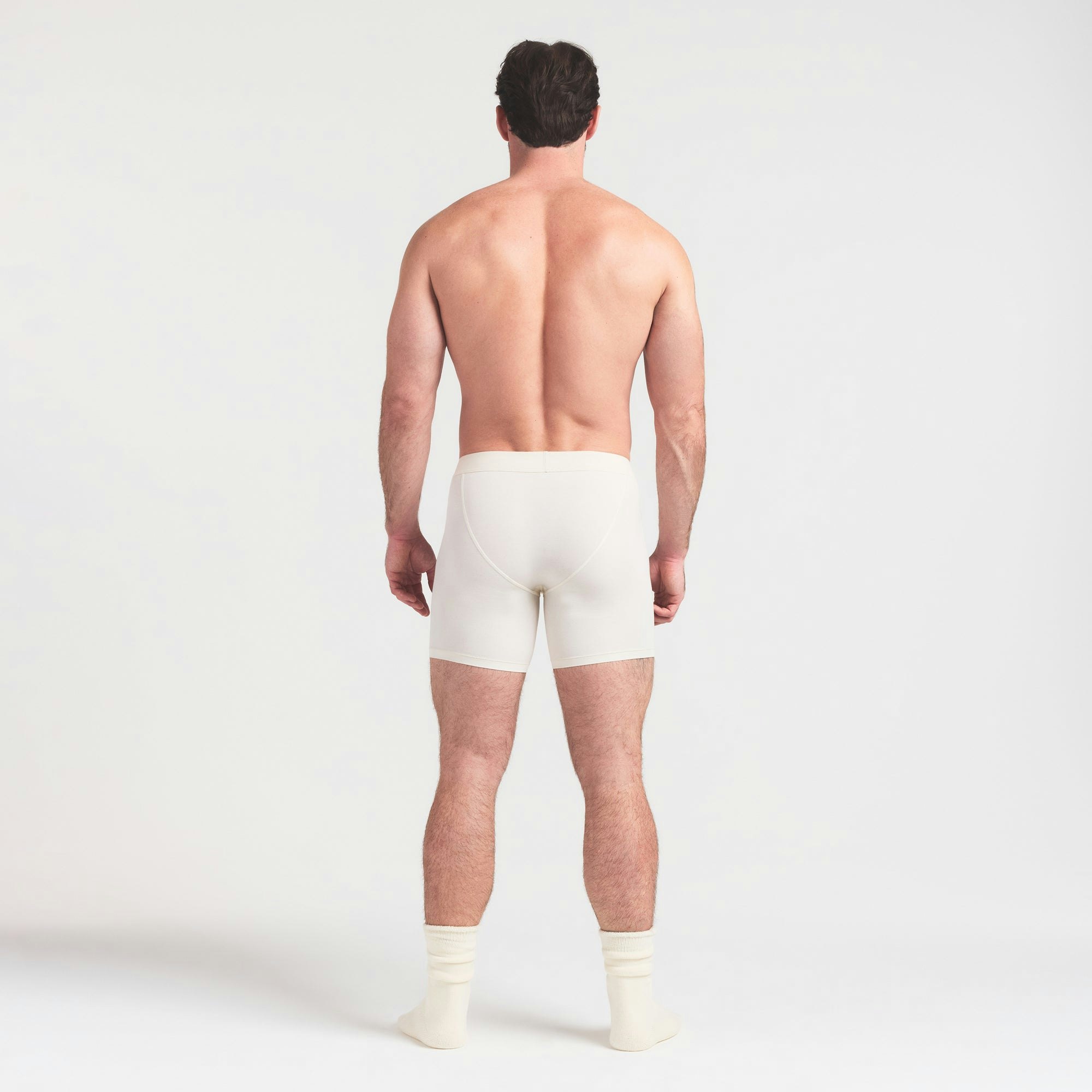 SKIMS FOR TEAM USA SKIMS COTTON MENS OLYMPIC 5 INCH BOXER BRIEF | ECRU ON A MODEL FRONT VIEW @ | FOCUS: 0.0, 1.0, 0.9