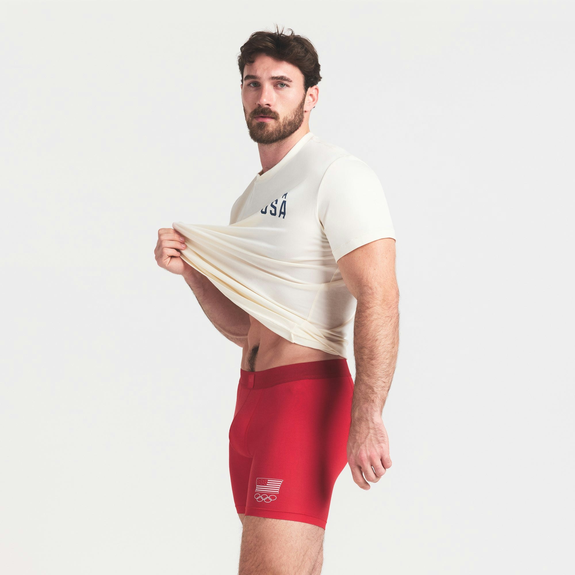 SKIMS FOR TEAM USA SKIMS COTTON MENS OLYMPIC 5 INCH BOXER BRIEF | RED ON A MODEL SIDE VIEW @ | FOCUS: 0.0, 1.0, 0.9
