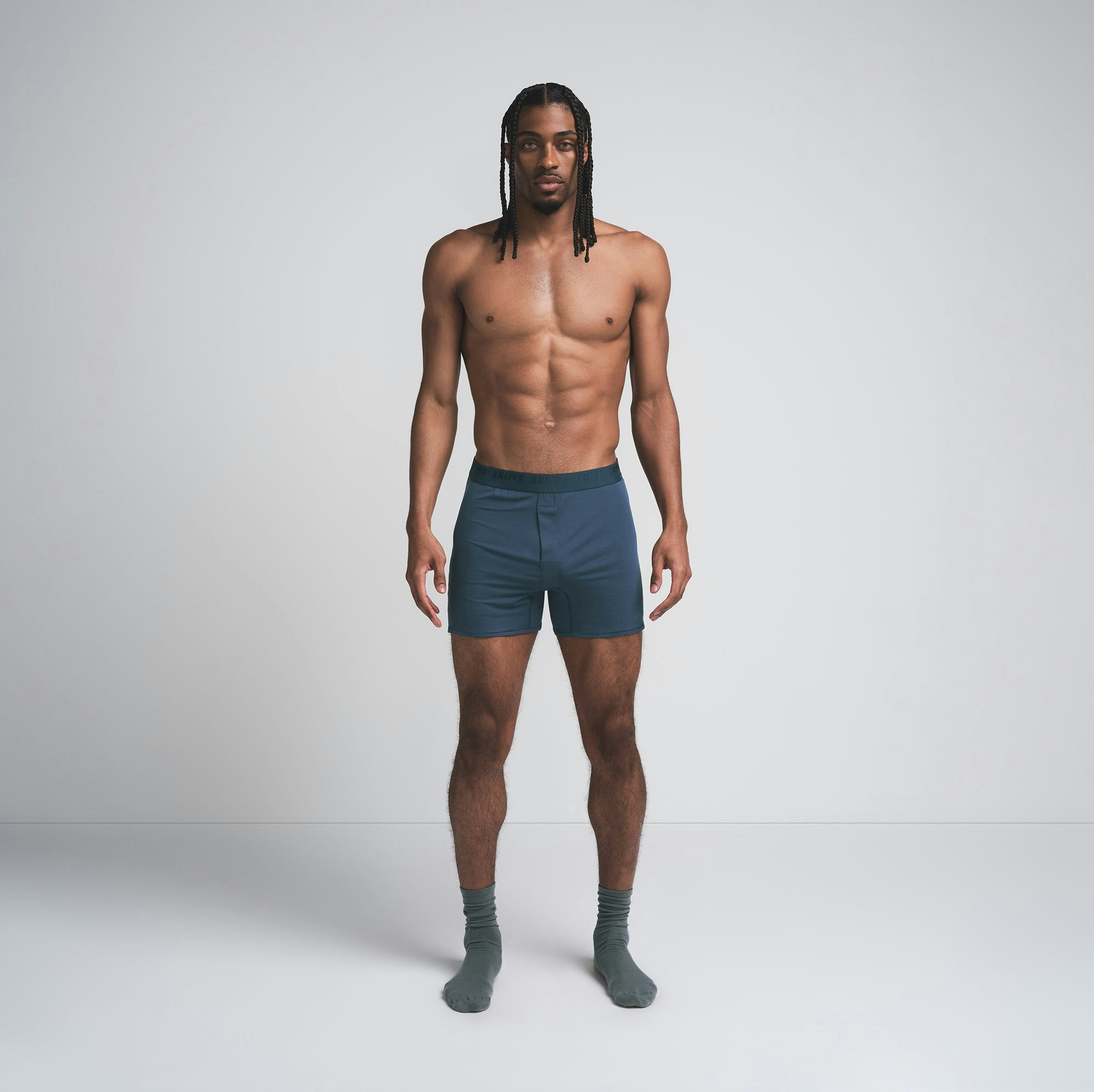 SKIMS STRETCH MENS KNIT BOXER | INDIGO ON A MODEL FRONT VIEW | FOCUS: 0.0, 1.0, 0.9