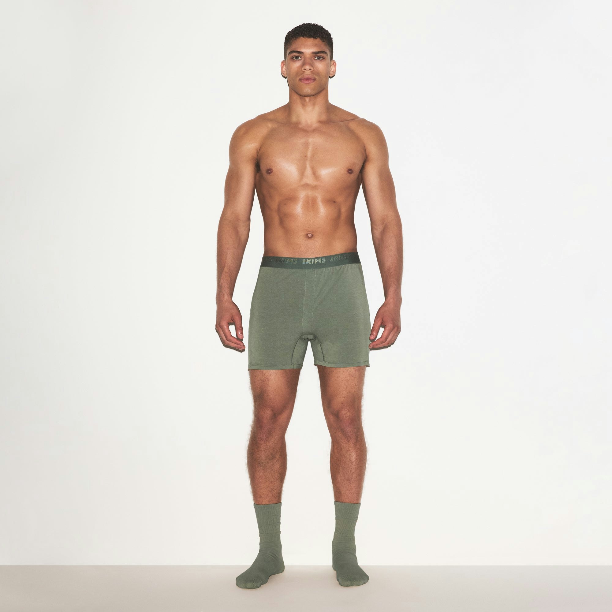 SKIMS STRETCH MENS KNIT BOXER | LAUREL ON A MODEL FRONT VIEW | FOCUS: 0.0, 1.0, 0.9