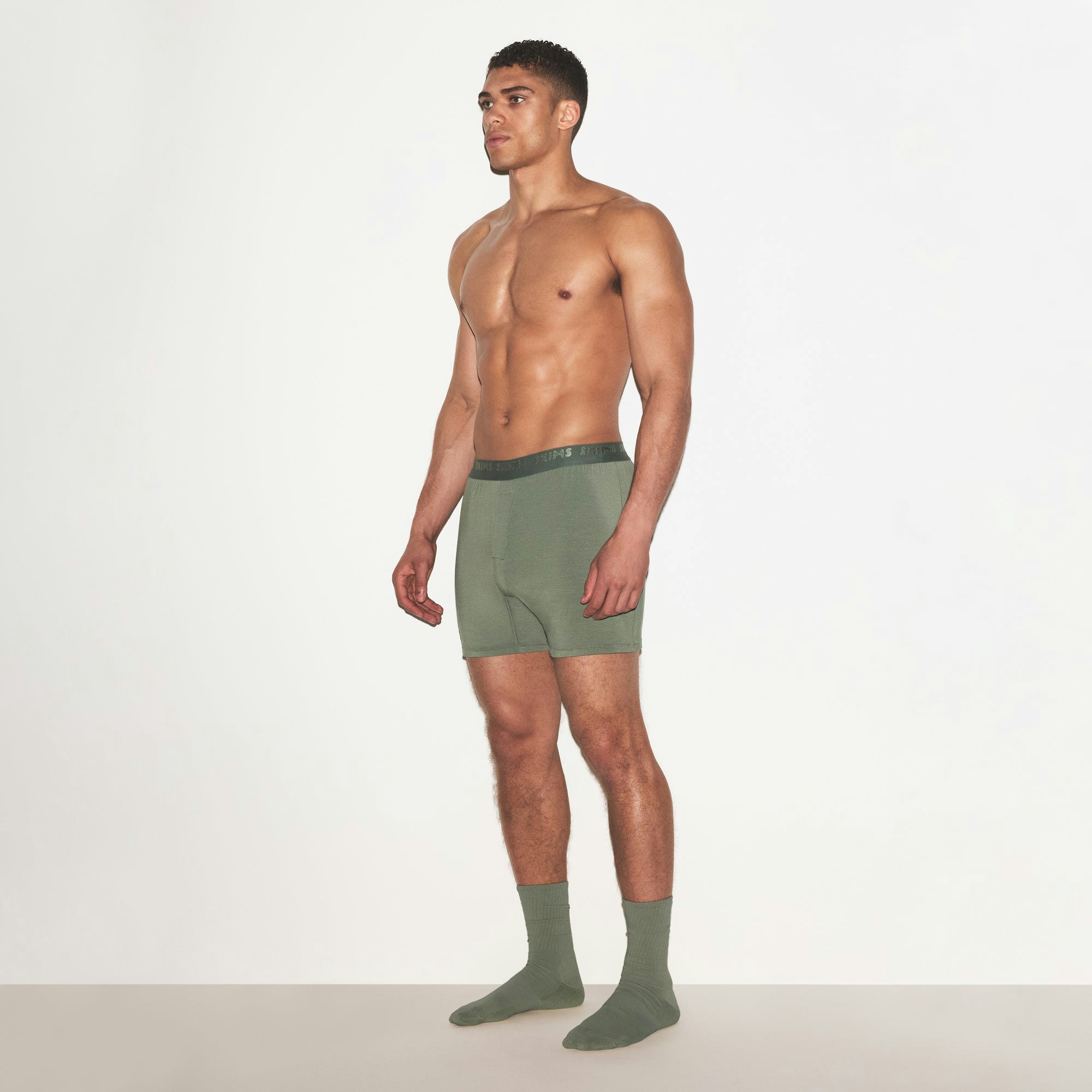 SKIMS STRETCH MENS KNIT BOXER | LAUREL ON A MODEL FRONT VIEW | FOCUS: 0.0, 1.0, 0.9