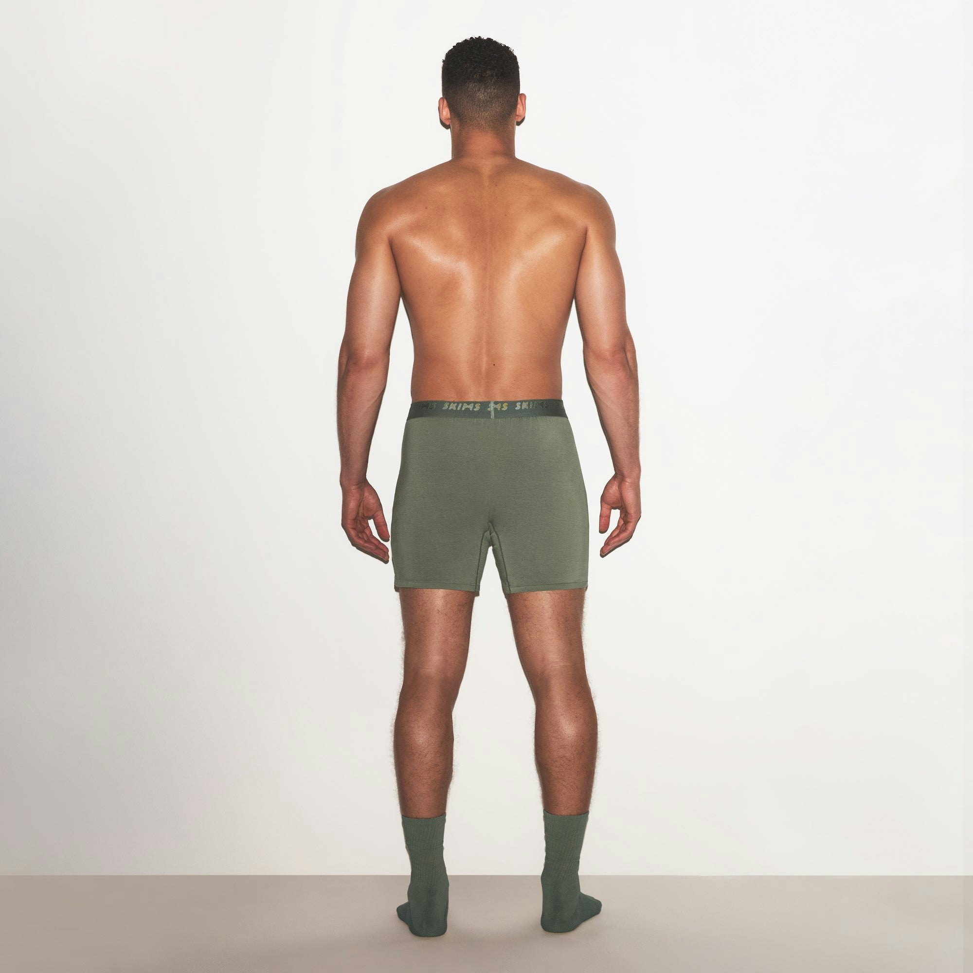 SKIMS STRETCH MENS KNIT BOXER | LAUREL ON A MODEL FRONT VIEW | FOCUS: 0.0, 1.0, 0.9