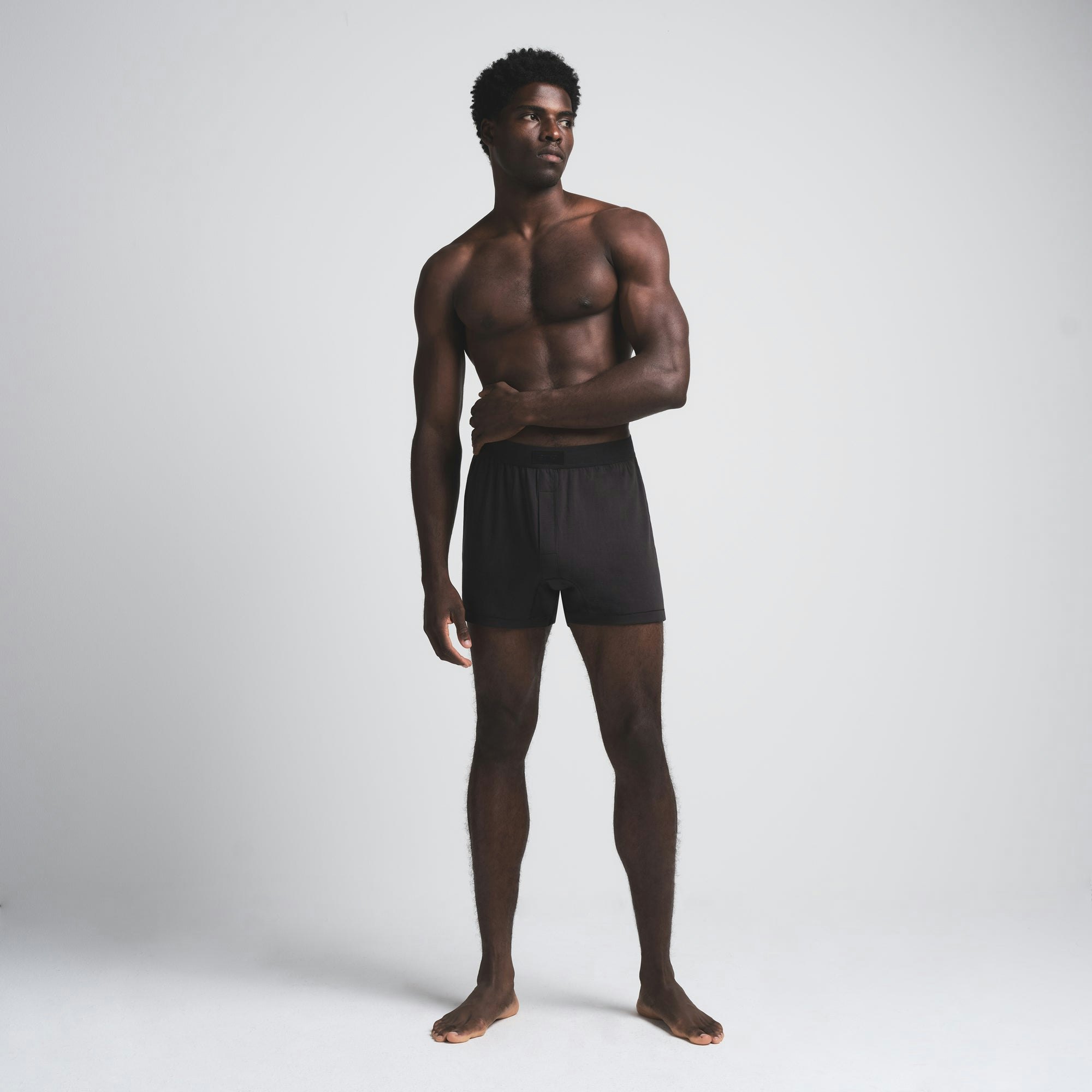 SKIMS COTTON MENS KNIT BOXER | ONYX ON A MODEL FRONT VIEW | FOCUS: 0.0, 1.0, 0.9 | FOCUS: 0.0, 1.0, 0.9