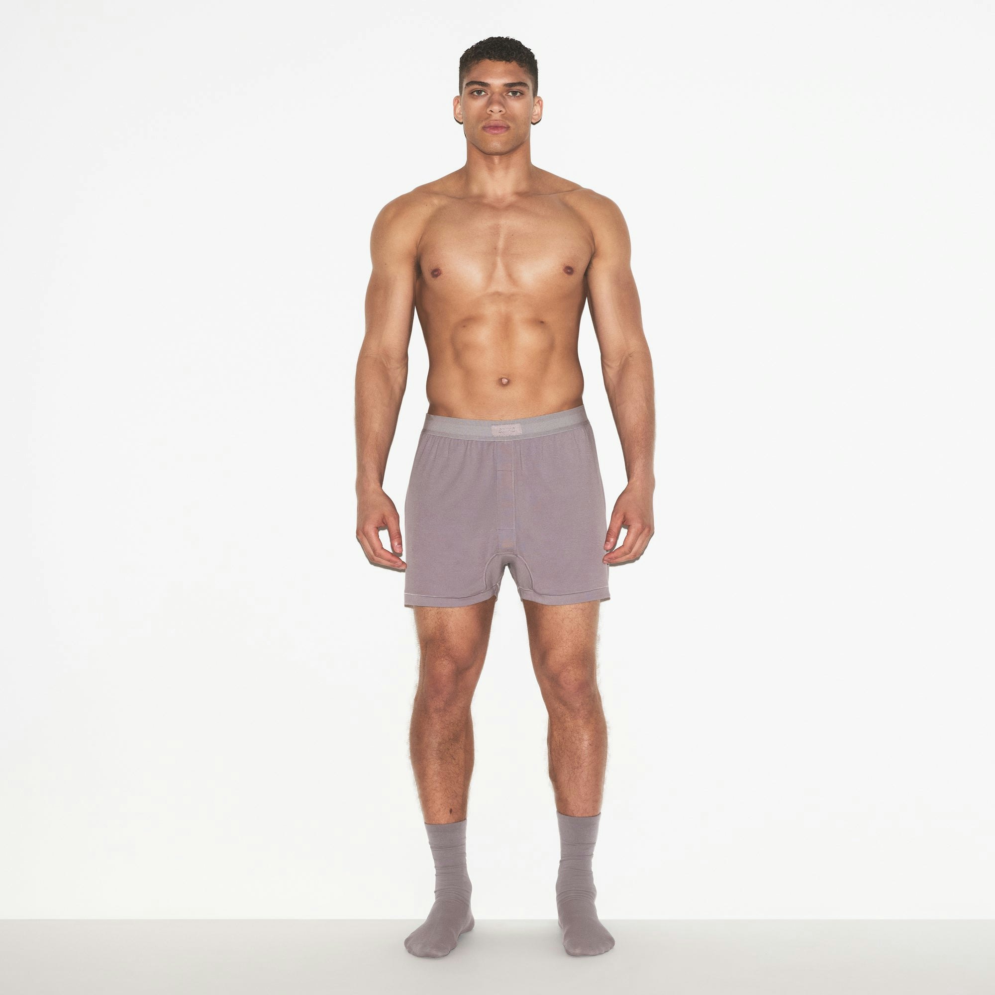 SKIMS COTTON MENS KNIT BOXER | ZINC ON A MODEL FRONT VIEW | FOCUS: 0.0, 1.0, 0.9