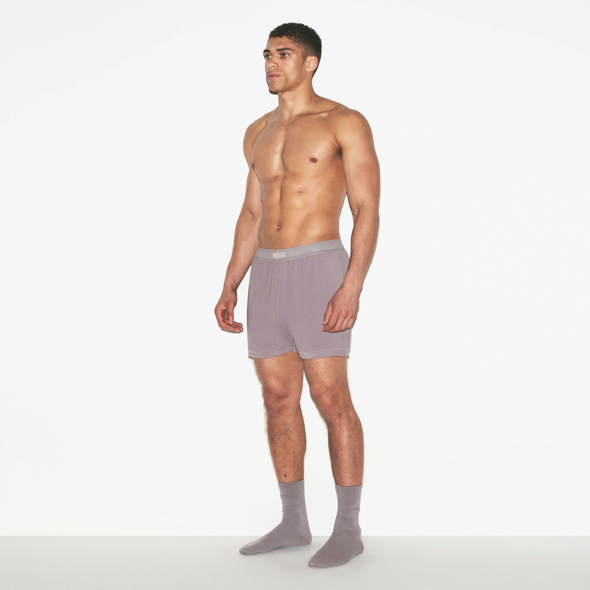 SKIMS COTTON MENS KNIT BOXER | ZINC ON A MODEL FRONT VIEW | FOCUS: 0.0, 1.0, 0.9