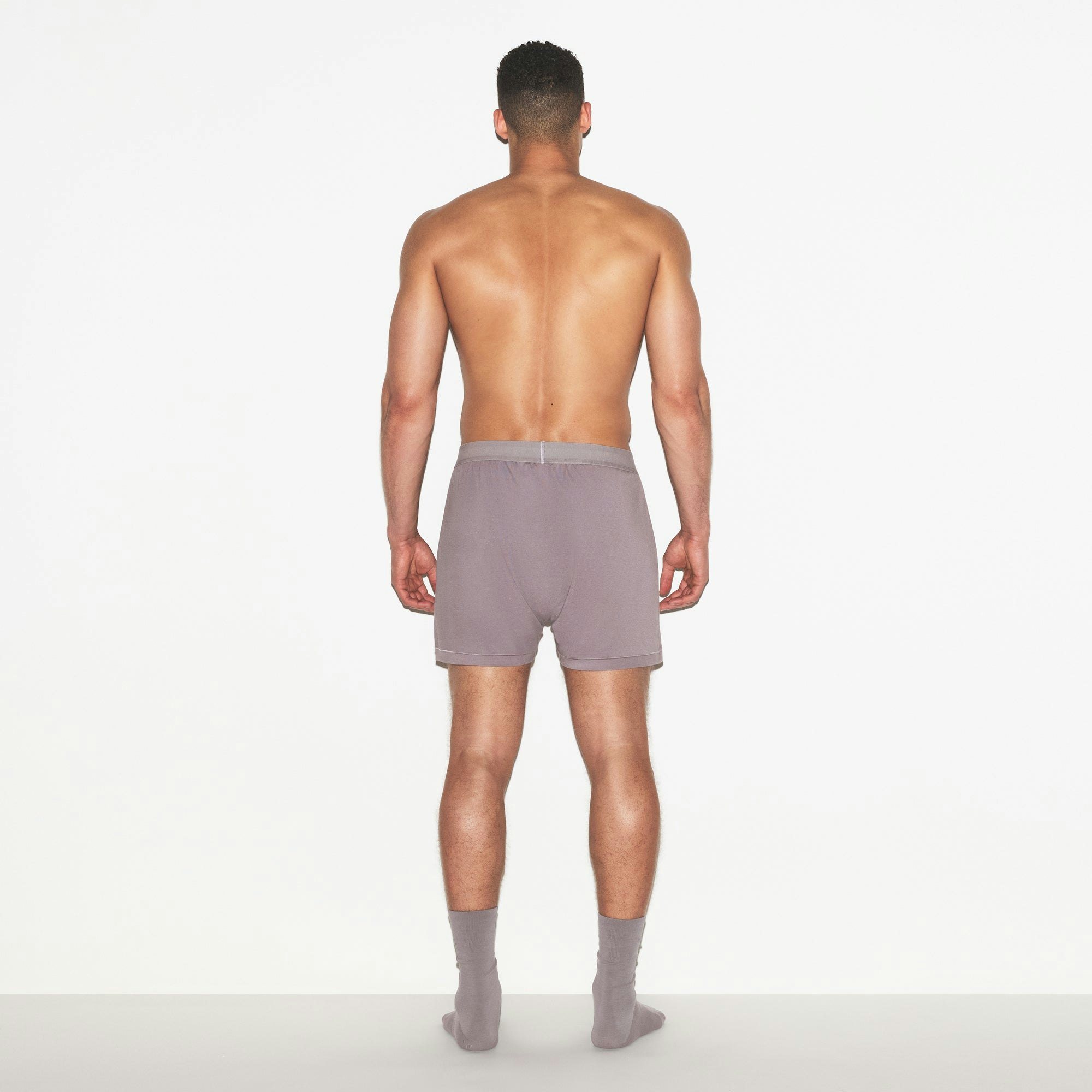 SKIMS COTTON MENS KNIT BOXER | ZINC ON A MODEL FRONT VIEW | FOCUS: 0.0, 1.0, 0.9