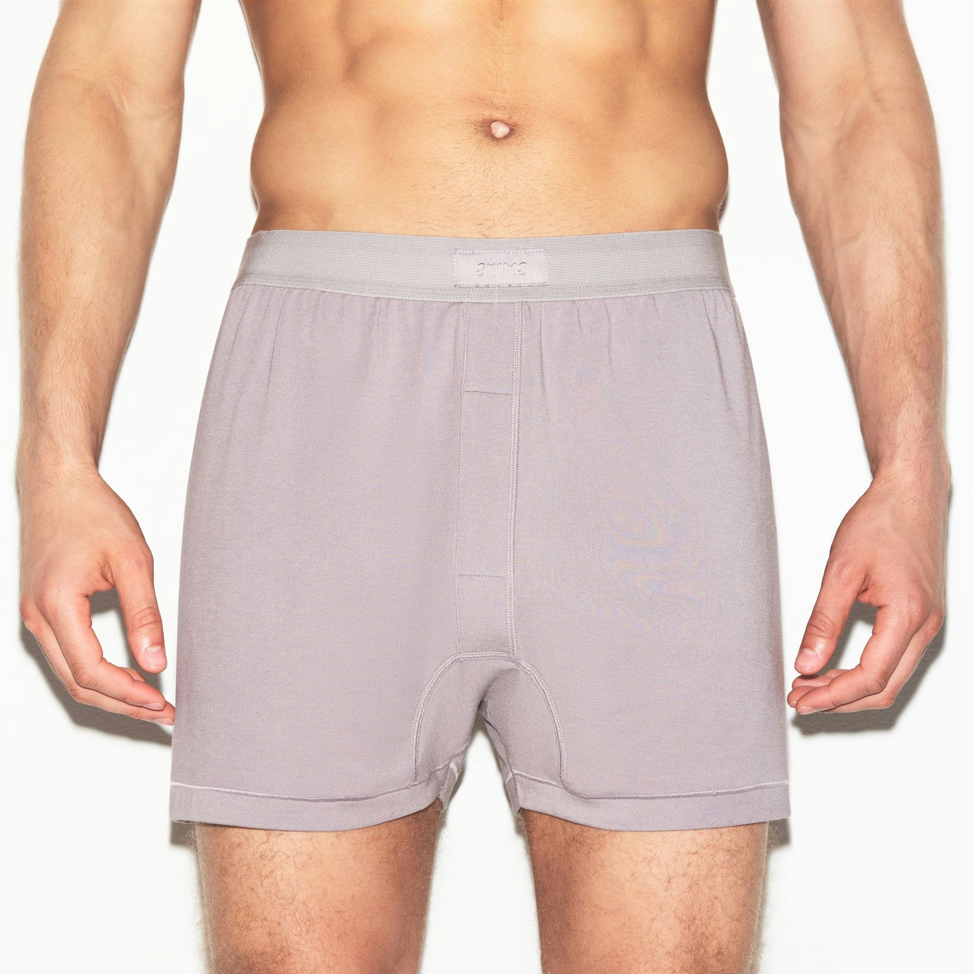 SKIMS COTTON MENS KNIT BOXER | ZINC ON A MODEL SIDE VIEW | FOCUS: 0.0, 1.0, 0.9