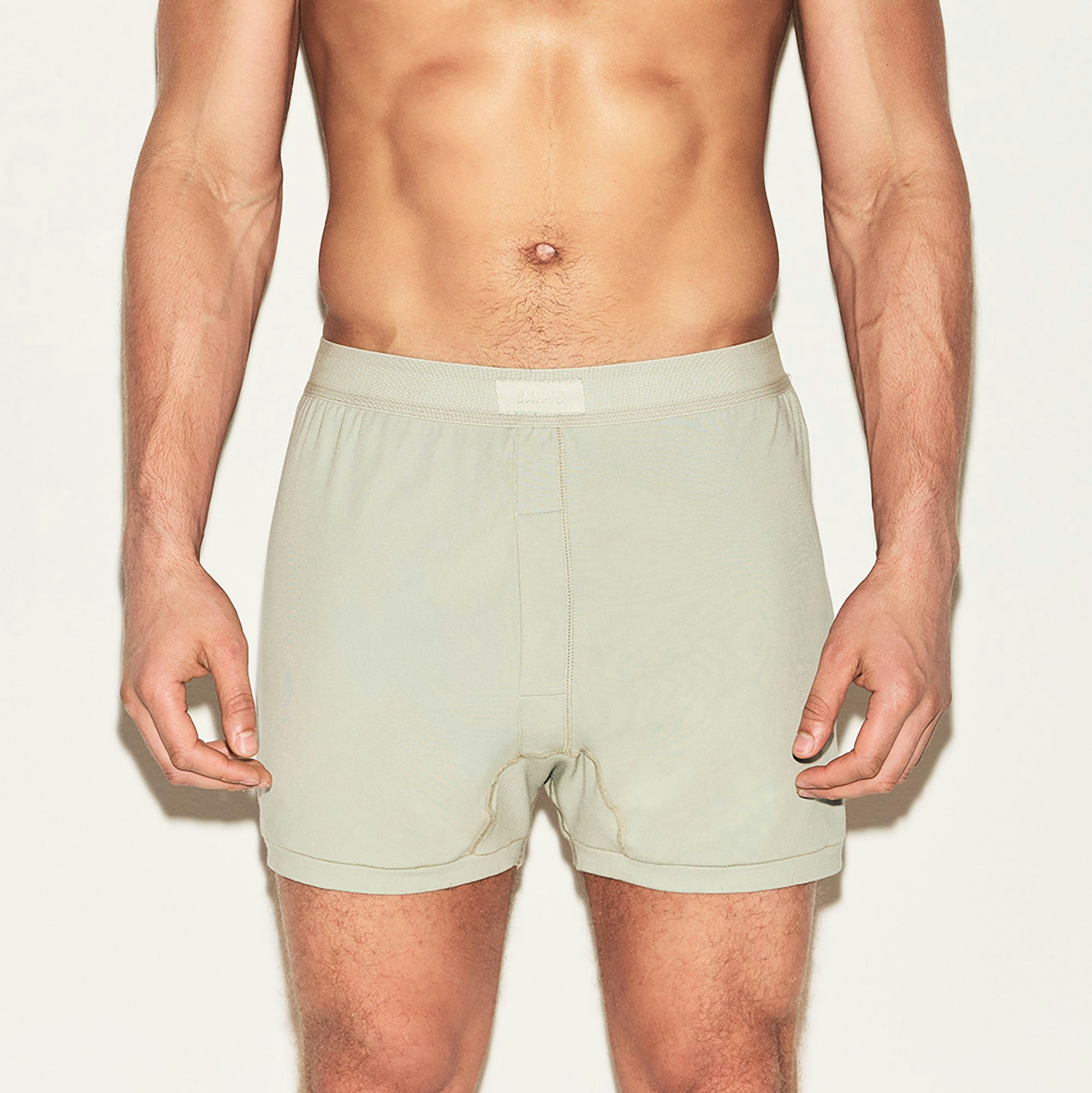 SKIMS COTTON MENS KNIT BOXER 3-PACK | ARMY MULTI ON A MODEL FRONT VIEW | FOCUS: 0.0, 1.0, 0.9