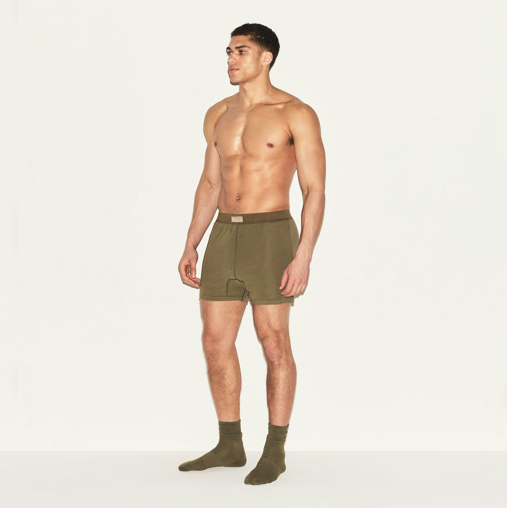 SKIMS COTTON MENS KNIT BOXER 3-PACK | ARMY MULTI ON A MODEL SIDE VIEW | FOCUS: 0.0, 1.0, 0.9