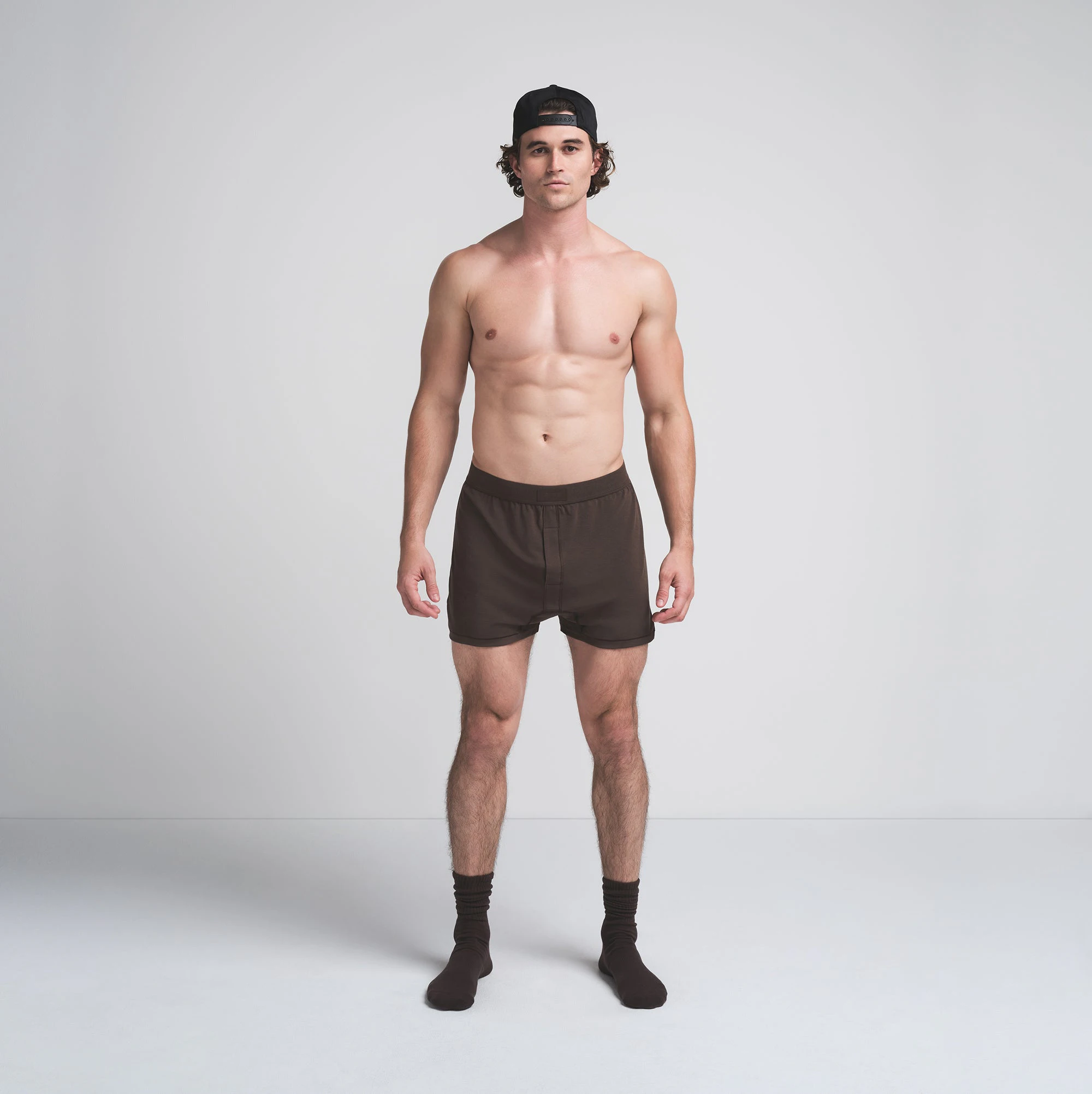 SKIMS COTTON MENS KNIT BOXER 3-PACK | DARK SEPIA MULTI ON A MODEL FRONT VIEW | FOCUS: 0.0, 1.0, 0.9