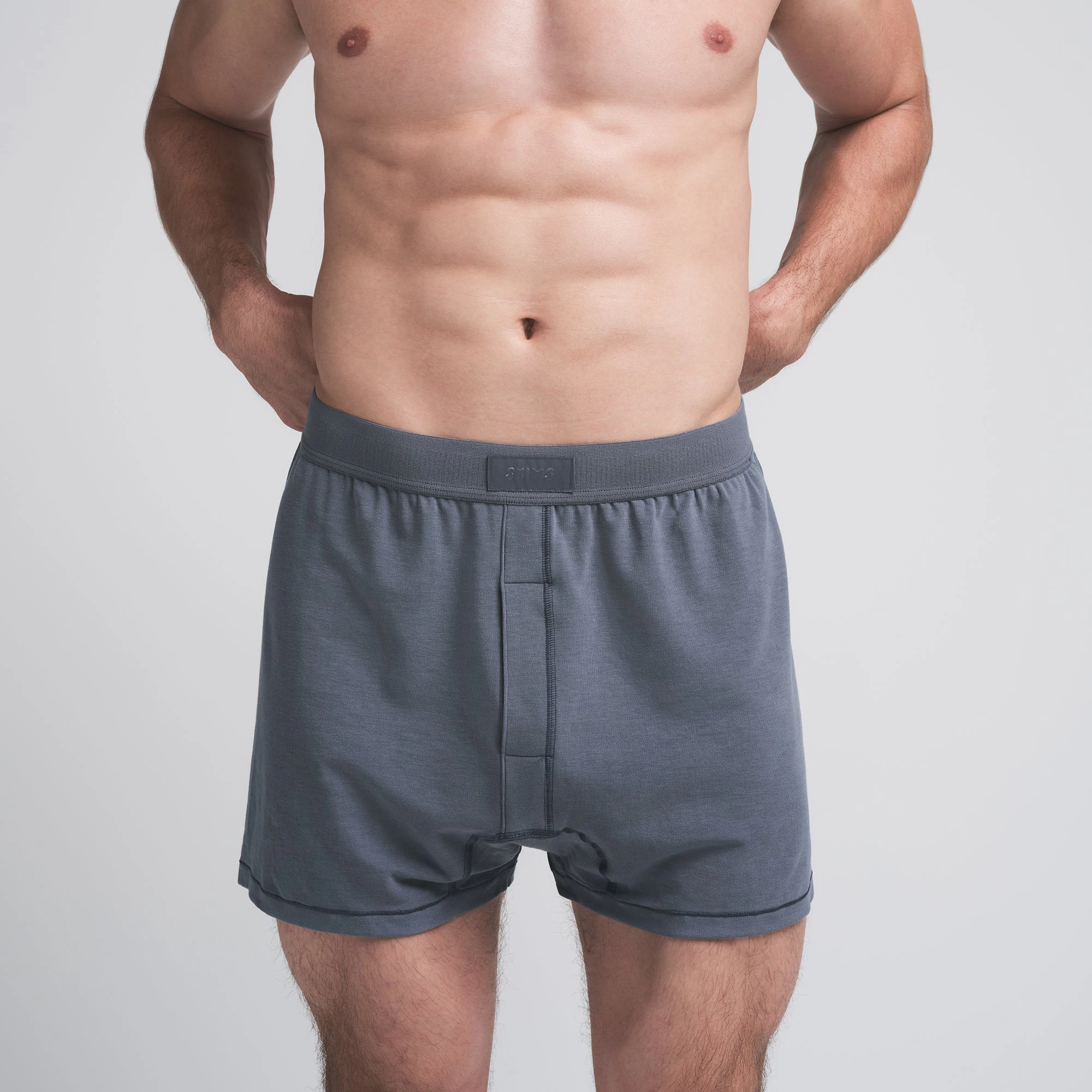 SKIMS COTTON MENS KNIT BOXER 3-PACK | DARK SEPIA MULTI ON A MODEL FRONT VIEW | FOCUS: 0.0, 1.0, 0.9