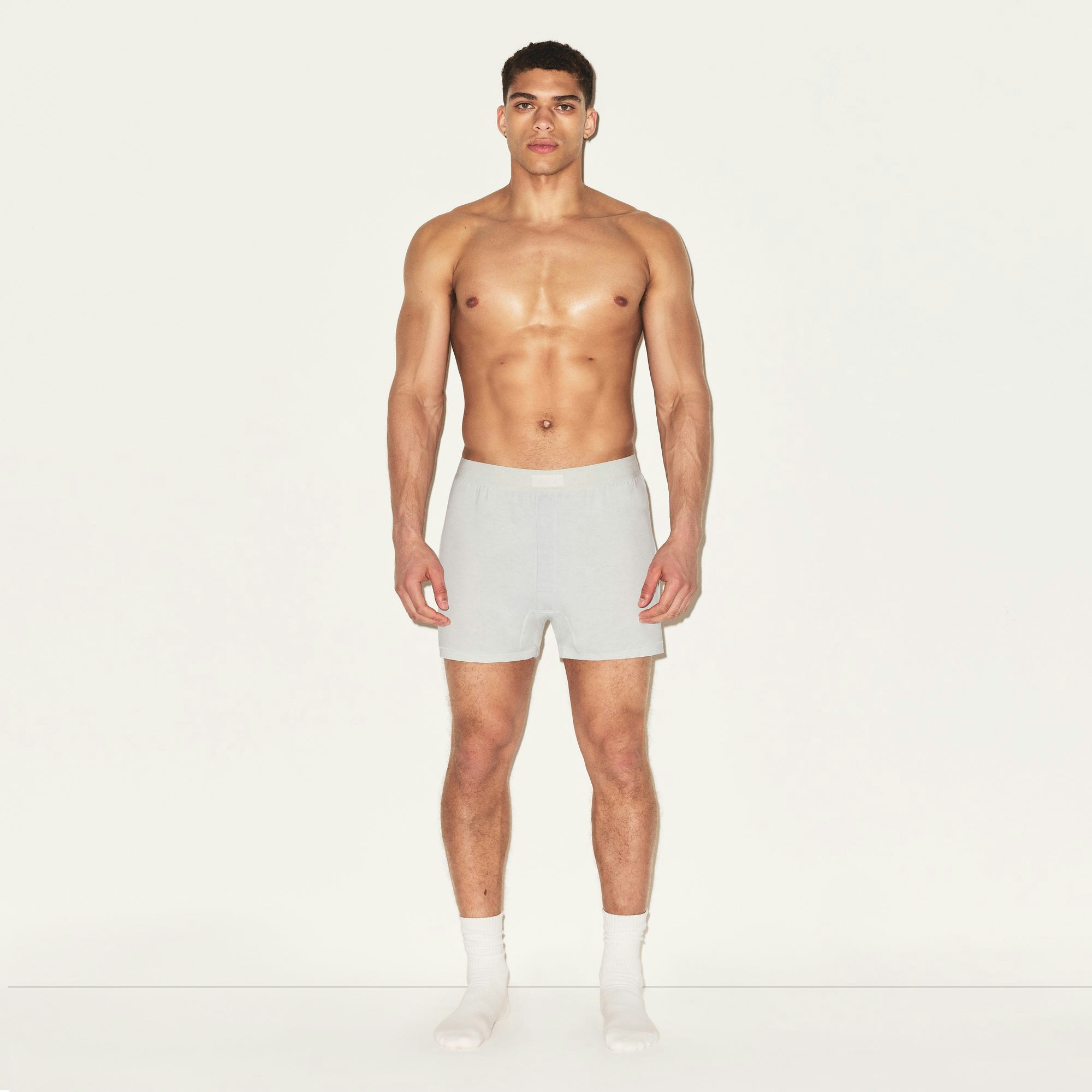 SKIMS COTTON MENS KNIT BOXER 3-PACK | HEATHER MULTI ON A MODEL FRONT VIEW | FOCUS: 0.0, 1.0, 0.9