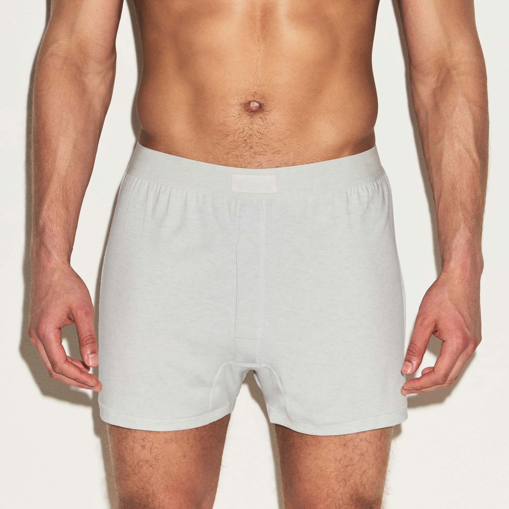 SKIMS COTTON MENS KNIT BOXER 3-PACK | HEATHER MULTI ON A MODEL SIDE VIEW | FOCUS: 0.0, 1.0, 0.9