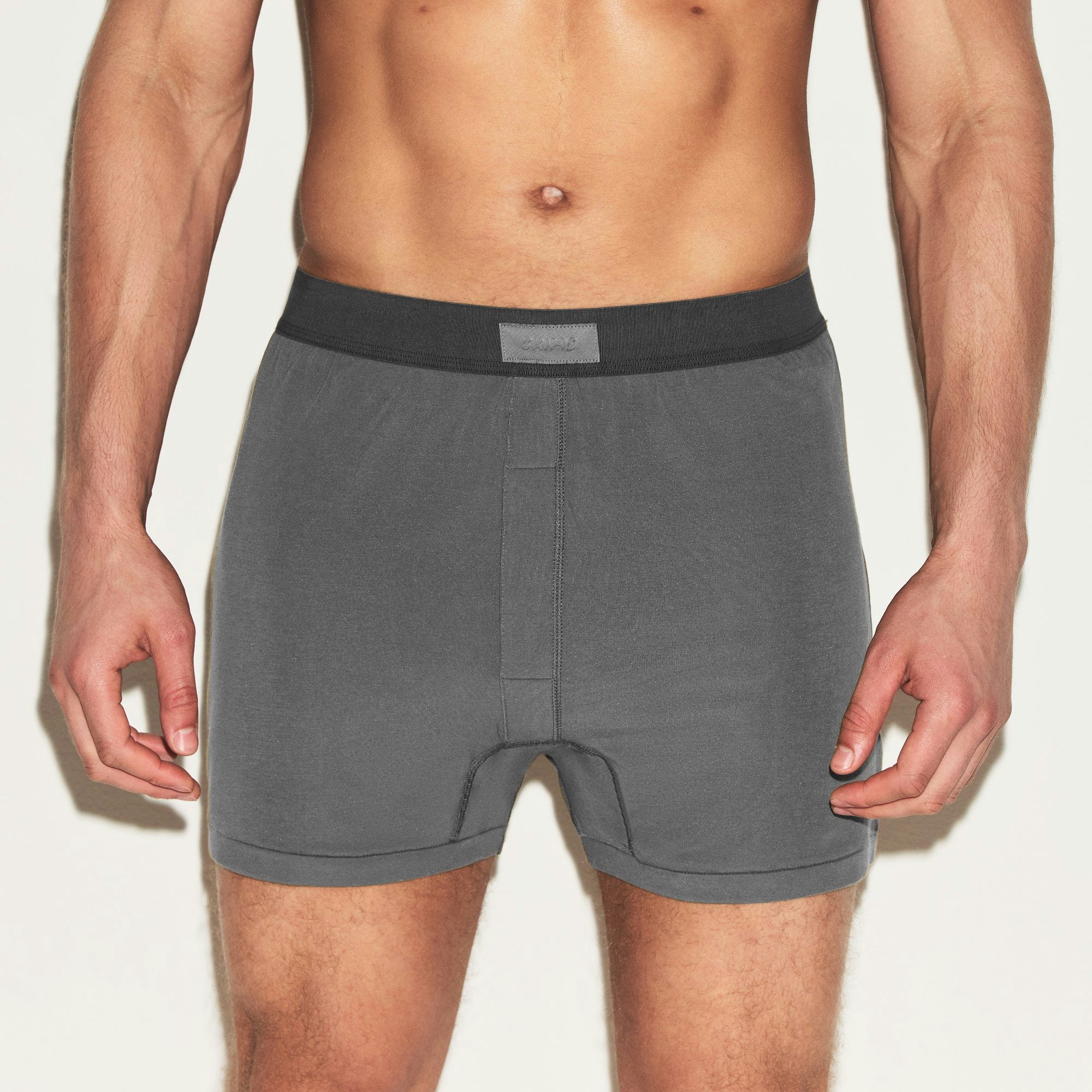 SKIMS COTTON MENS KNIT BOXER 3-PACK | HEATHER MULTI ON A MODEL SIDE VIEW | FOCUS: 0.0, 1.0, 0.9