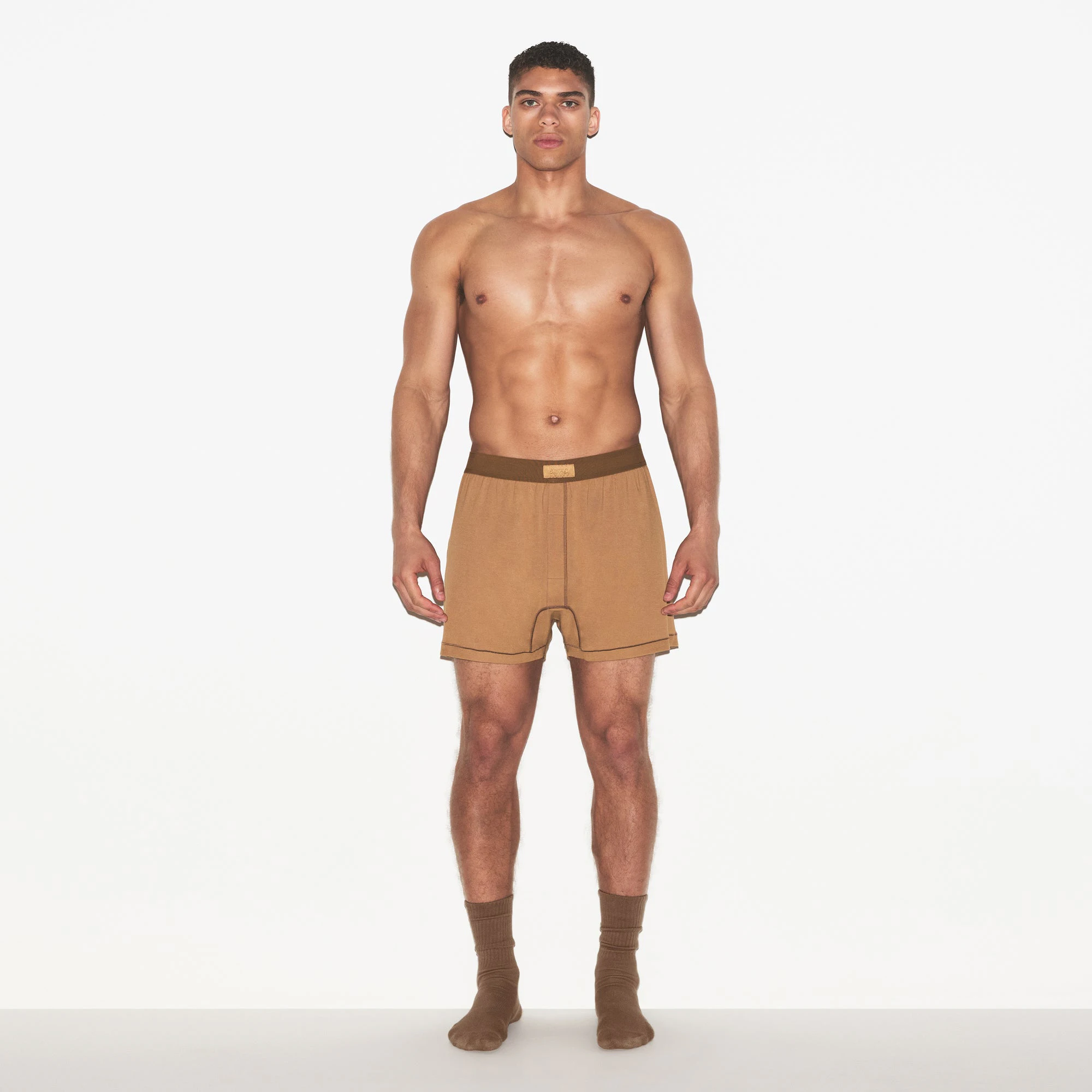 SKIMS COTTON MENS KNIT BOXER 3-PACK | RUSSET MULTI ON A MODEL FRONT VIEW | FOCUS: 0.0, 1.0, 0.9