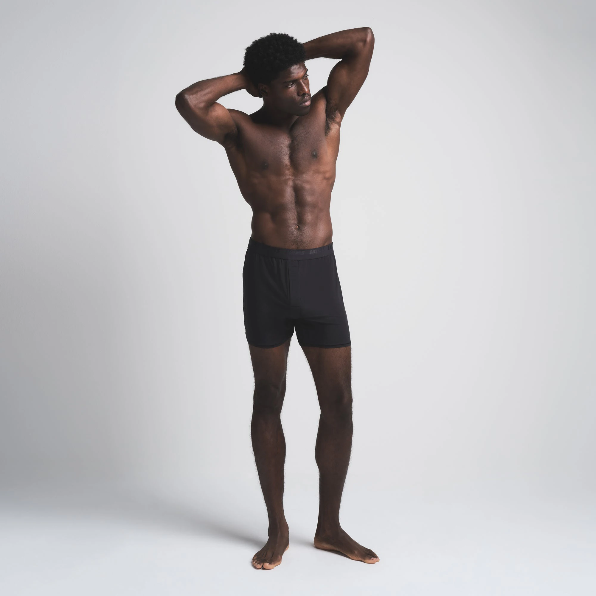 SKIMS STRETCH MENS KNIT BOXER 3-PACK | OBSIDIAN (MENS BOXERS) ON A MODEL FRONT VIEW
