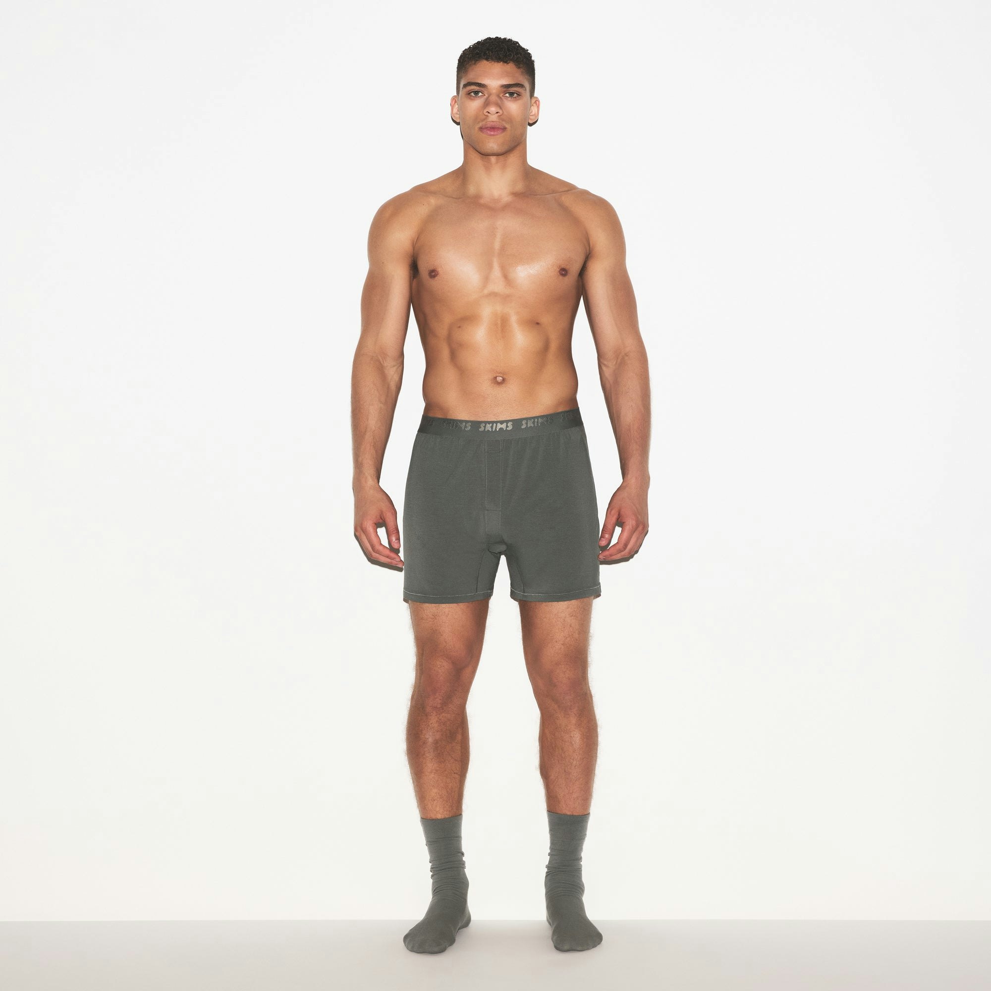 SKIMS STRETCH MENS KNIT BOXER 3-PACK | GUNMETAL MULTI ON A MODEL FRONT VIEW | FOCUS: 0.0, 1.0, 0.9
