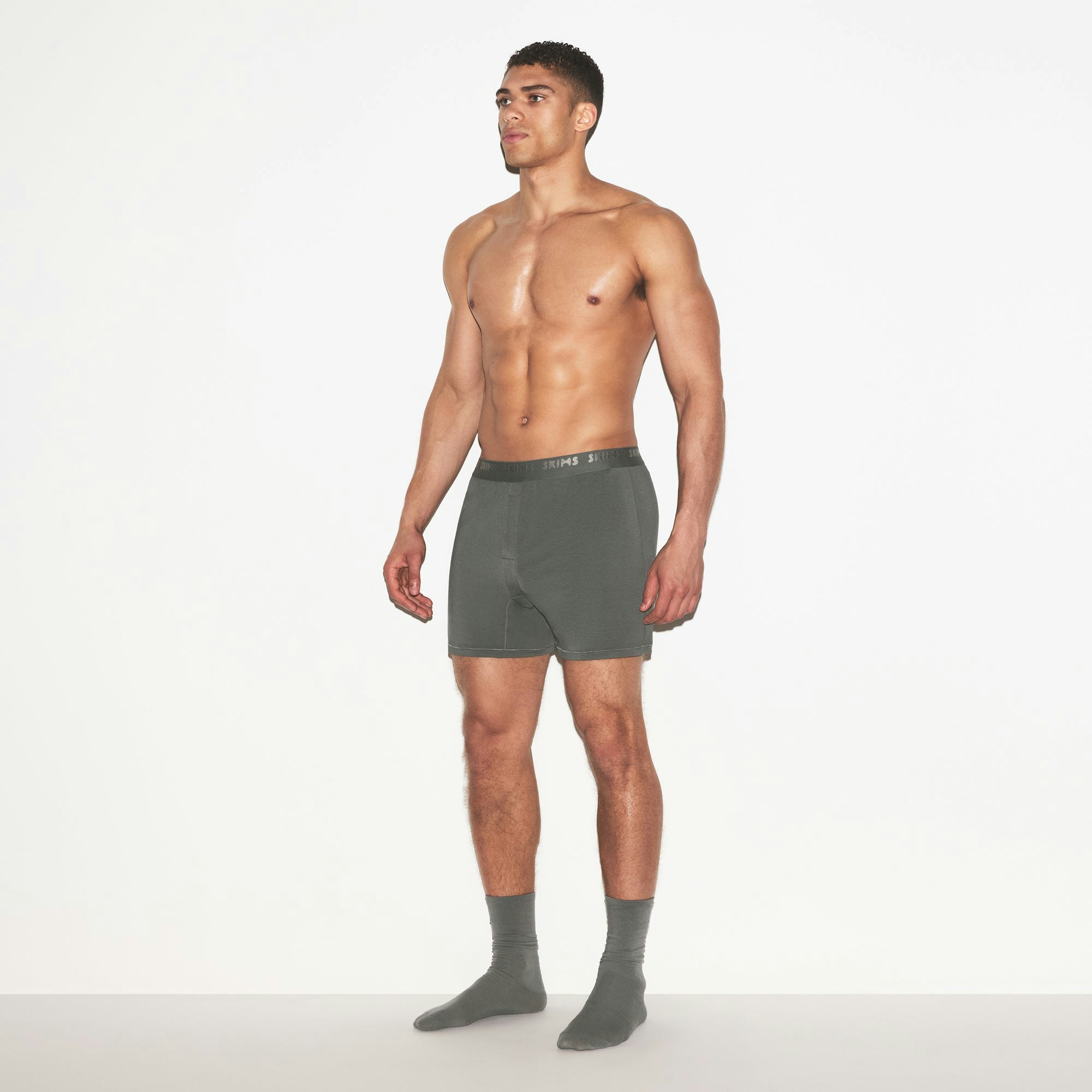 SKIMS STRETCH MENS KNIT BOXER 3-PACK | GUNMETAL MULTI ON A MODEL FRONT VIEW | FOCUS: 0.0, 1.0, 0.9