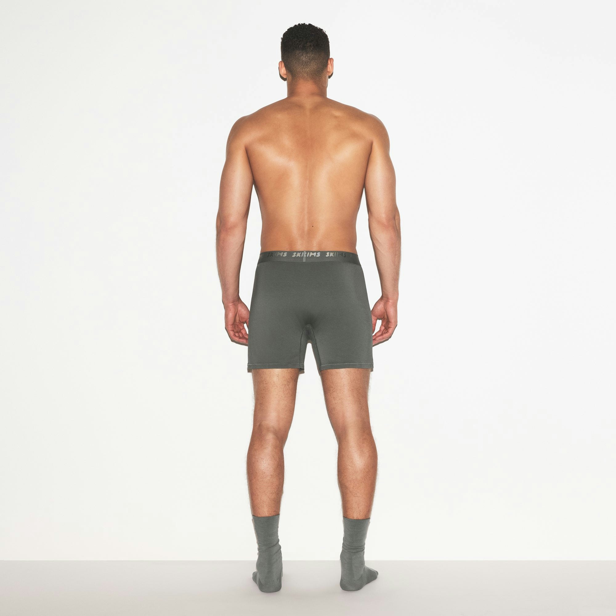 SKIMS STRETCH MENS KNIT BOXER 3-PACK | GUNMETAL MULTI ON A MODEL FRONT VIEW | FOCUS: 0.0, 1.0, 0.9