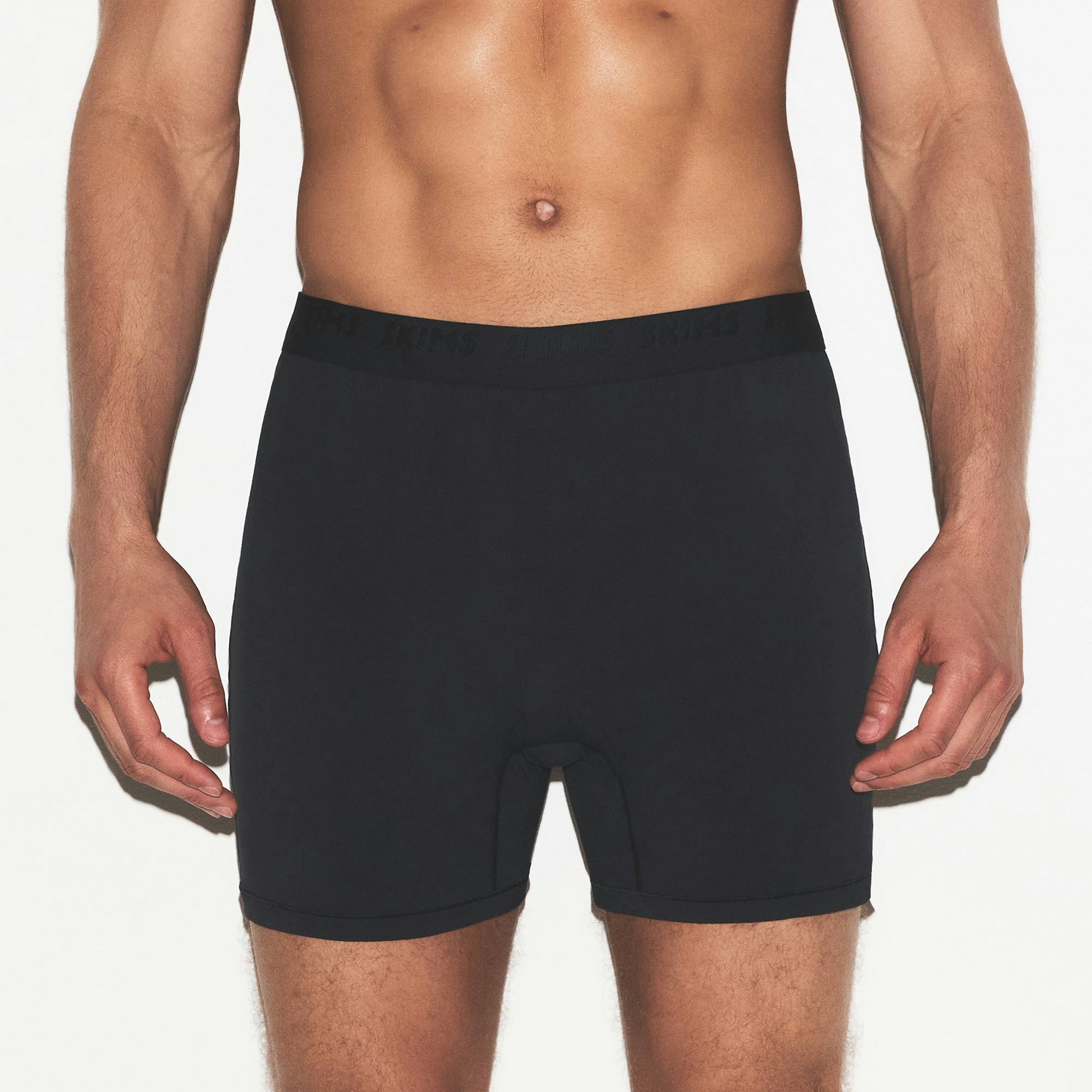 SKIMS STRETCH MENS KNIT BOXER 3-PACK | GUNMETAL MULTI ON A MODEL SIDE VIEW | FOCUS: 0.0, 1.0, 0.9