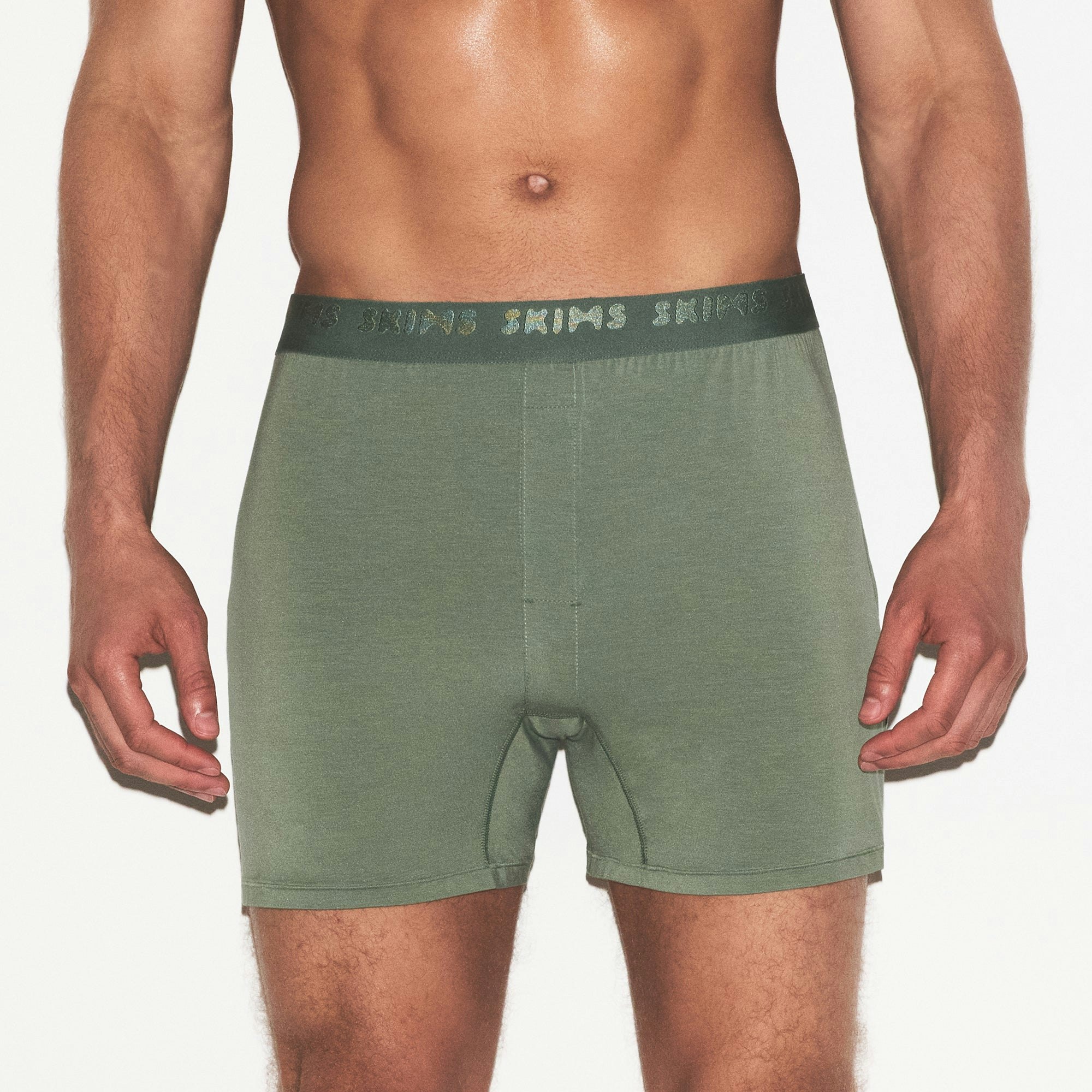 SKIMS STRETCH MENS KNIT BOXER 3-PACK | LAUREL MULTI ON A MODEL SIDE VIEW | FOCUS: 0.0, 1.0, 0.9