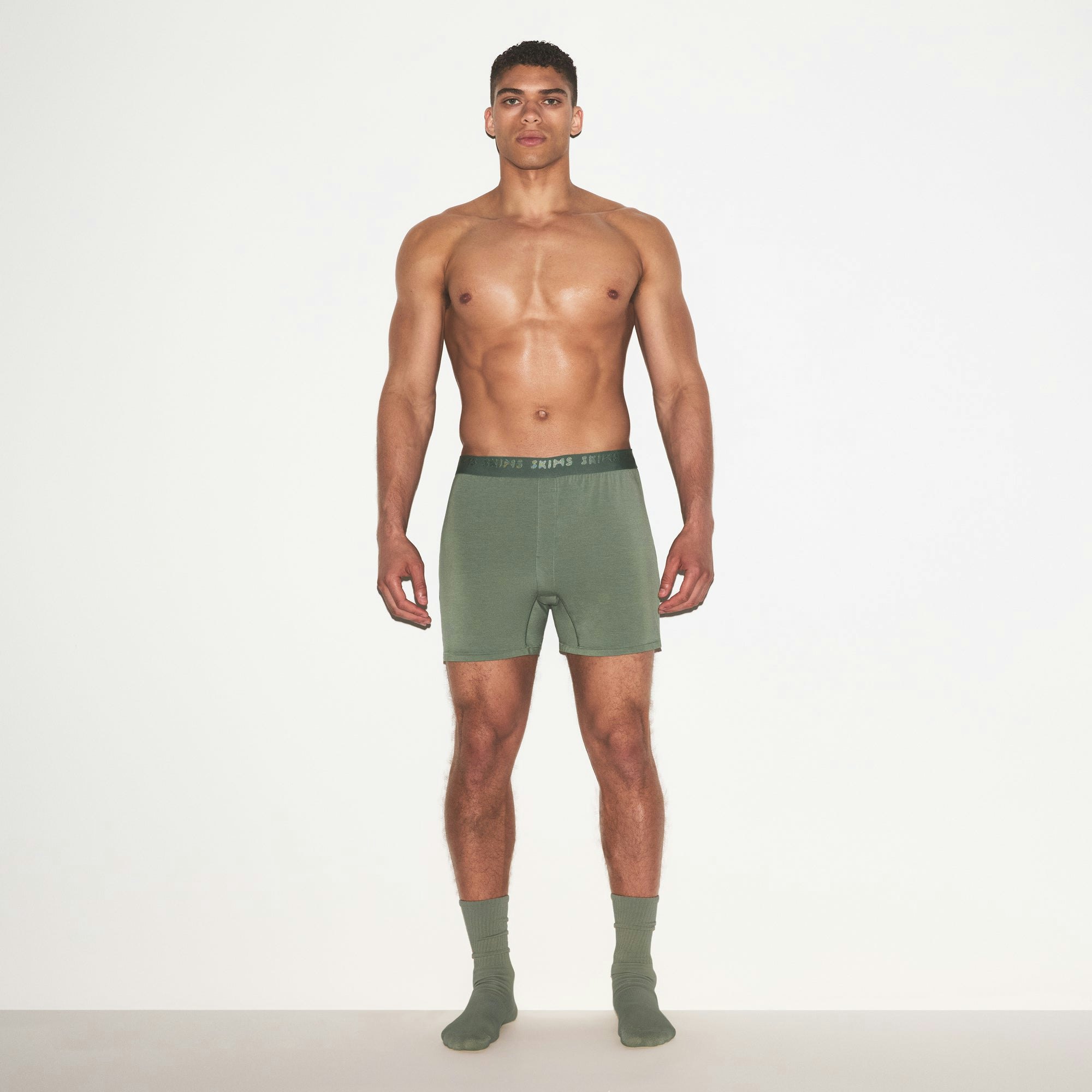 SKIMS STRETCH MENS KNIT BOXER 3-PACK | LAUREL MULTI ON A MODEL FRONT VIEW | FOCUS: 0.0, 1.0, 0.9