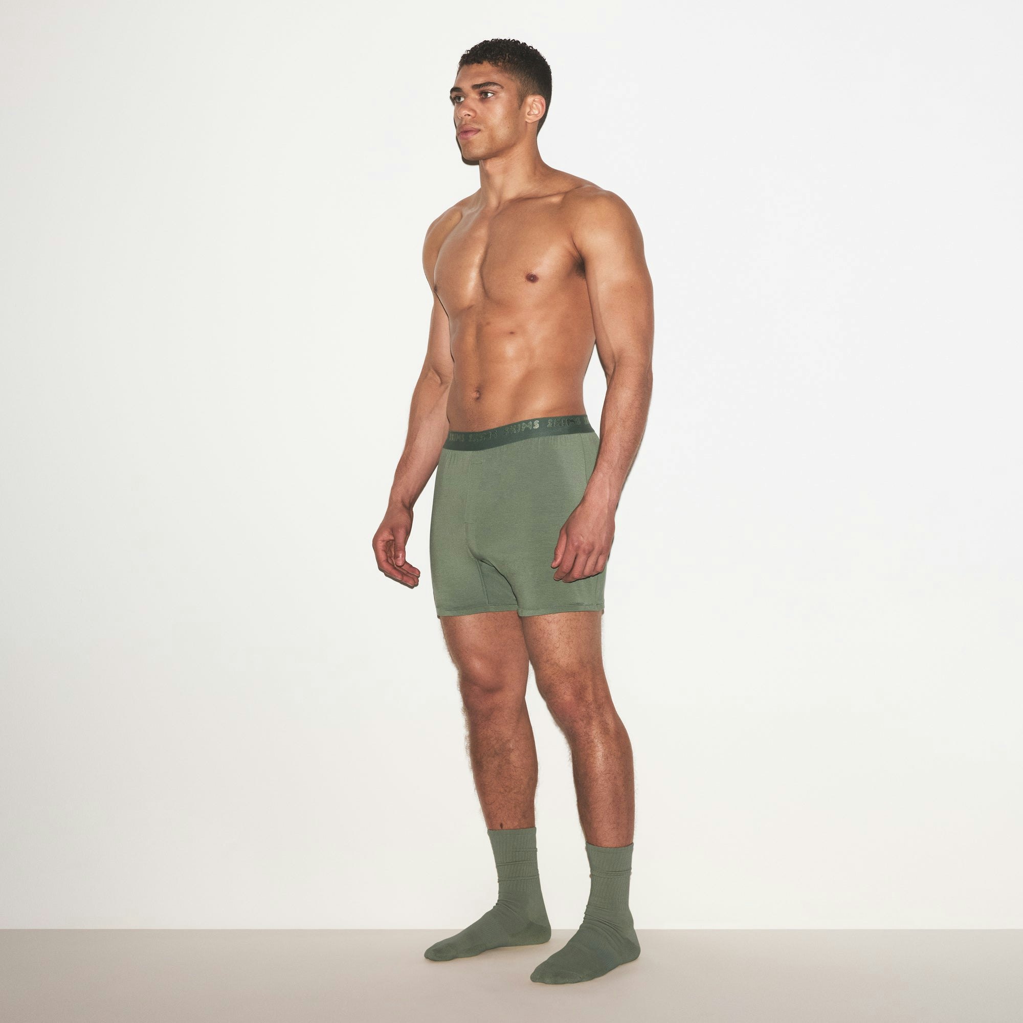 SKIMS STRETCH MENS KNIT BOXER 3-PACK | LAUREL MULTI ON A MODEL FRONT VIEW | FOCUS: 0.0, 1.0, 0.9