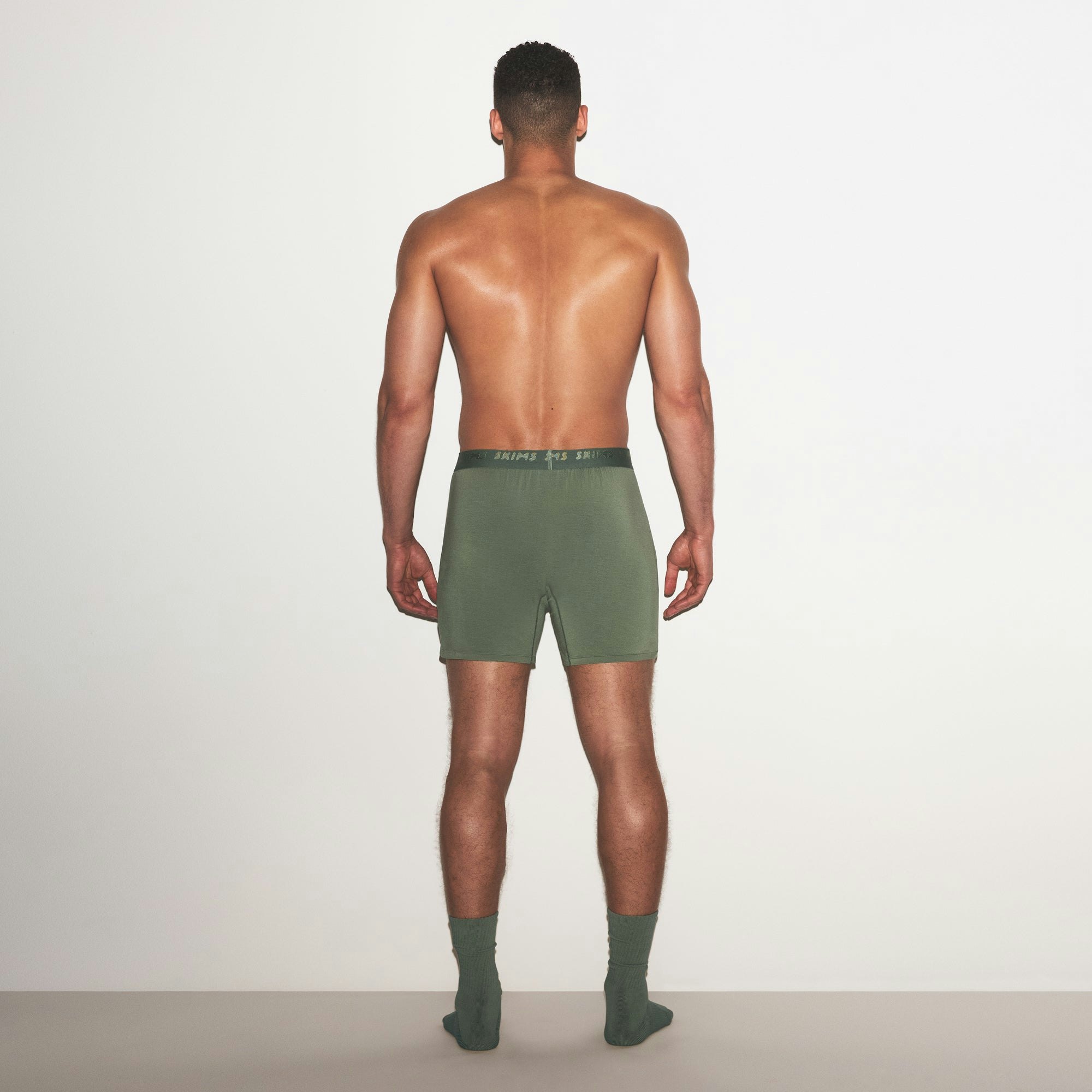 SKIMS STRETCH MENS KNIT BOXER 3-PACK | LAUREL MULTI ON A MODEL FRONT VIEW | FOCUS: 0.0, 1.0, 0.9