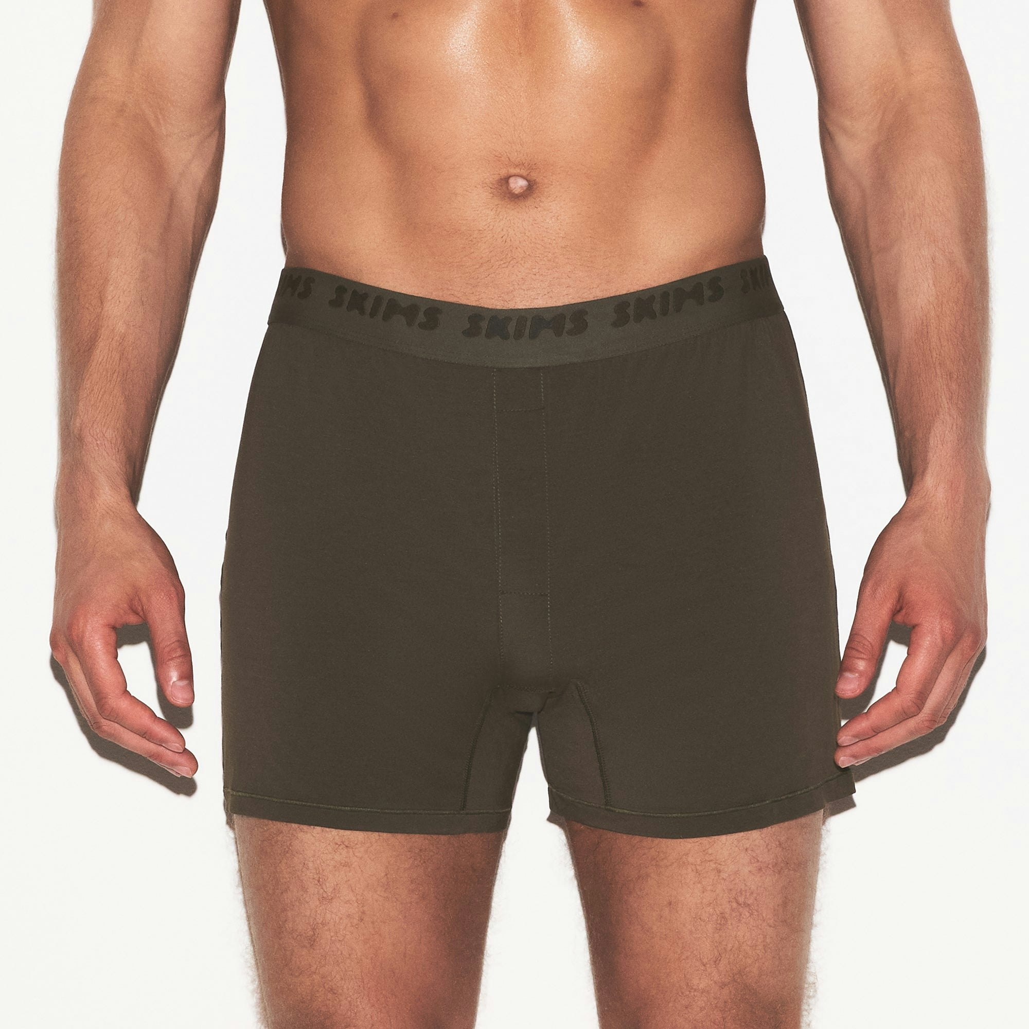 SKIMS STRETCH MENS KNIT BOXER 3-PACK | LAUREL MULTI ON A MODEL SIDE VIEW | FOCUS: 0.0, 1.0, 0.9