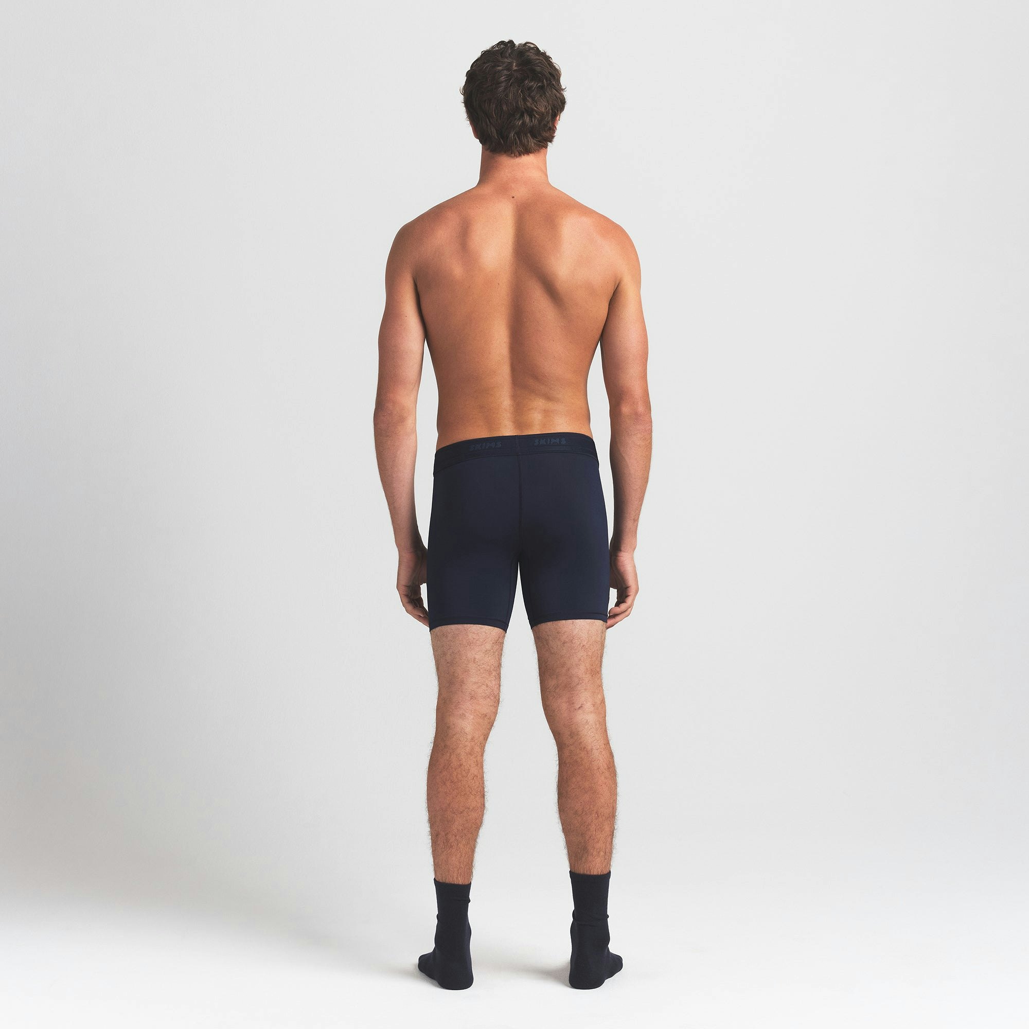 SKIMS FLEX MENS 5" BOXER BRIEF 3-PACK | NAVY GUNMETAL MULTI ON A MODEL BACK VIEW @ | FOCUS: 0.0, 1.0, 0.9