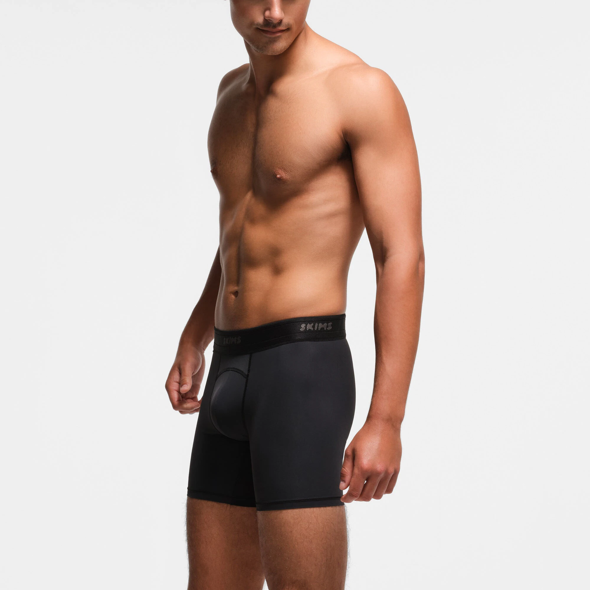 SKIMS SPORT MENS 5" BOXER BRIEF 3-PACK | OBSIDIAN ON A MODEL SIDE VIEW