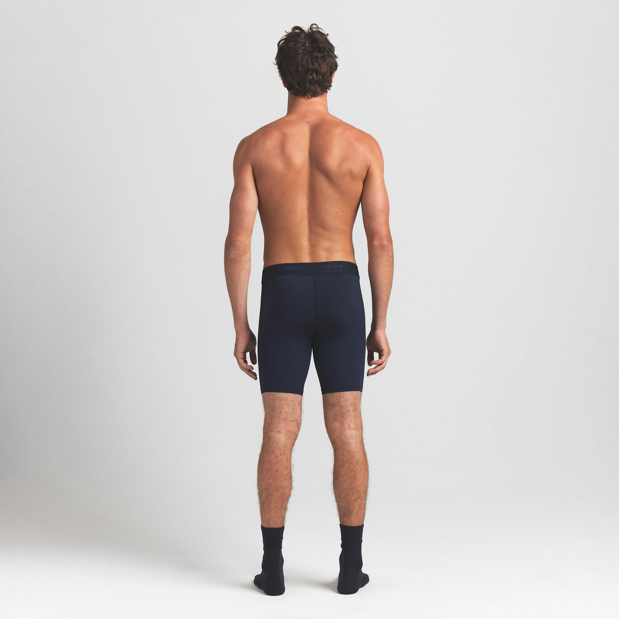 SKIMS FLEX MENS 7" BOXER BRIEF 3-PACK | NAVY GUNMETAL MULTI ON A MODEL BACK VIEW @ | FOCUS: 0.0, 1.0, 0.9
