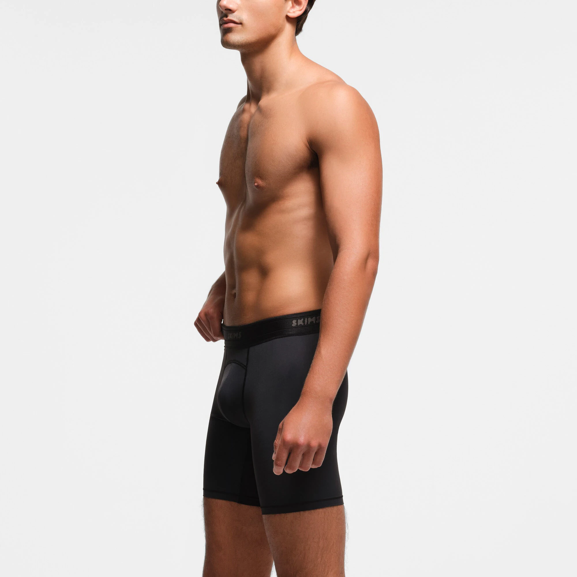 SKIMS SPORT MENS 7" BOXER BRIEF 3-PACK | OBSIDIAN ON A MODEL SIDE VIEW