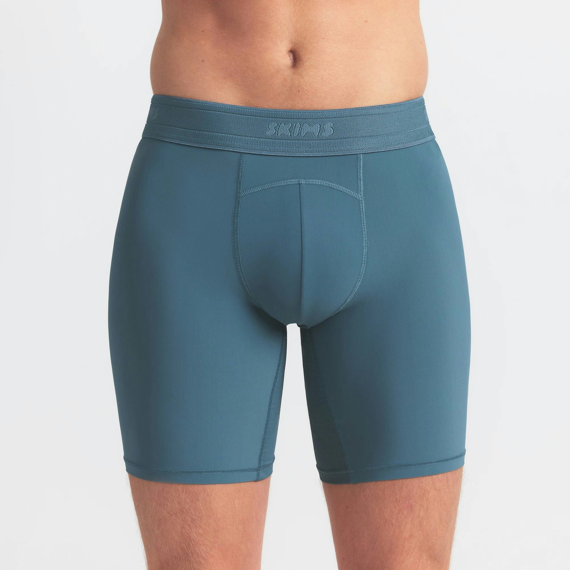 SKIMS FLEX MENS 7" BOXER BRIEF 3-PACK | TINT MULTI ON A MODEL SIDE VIEW