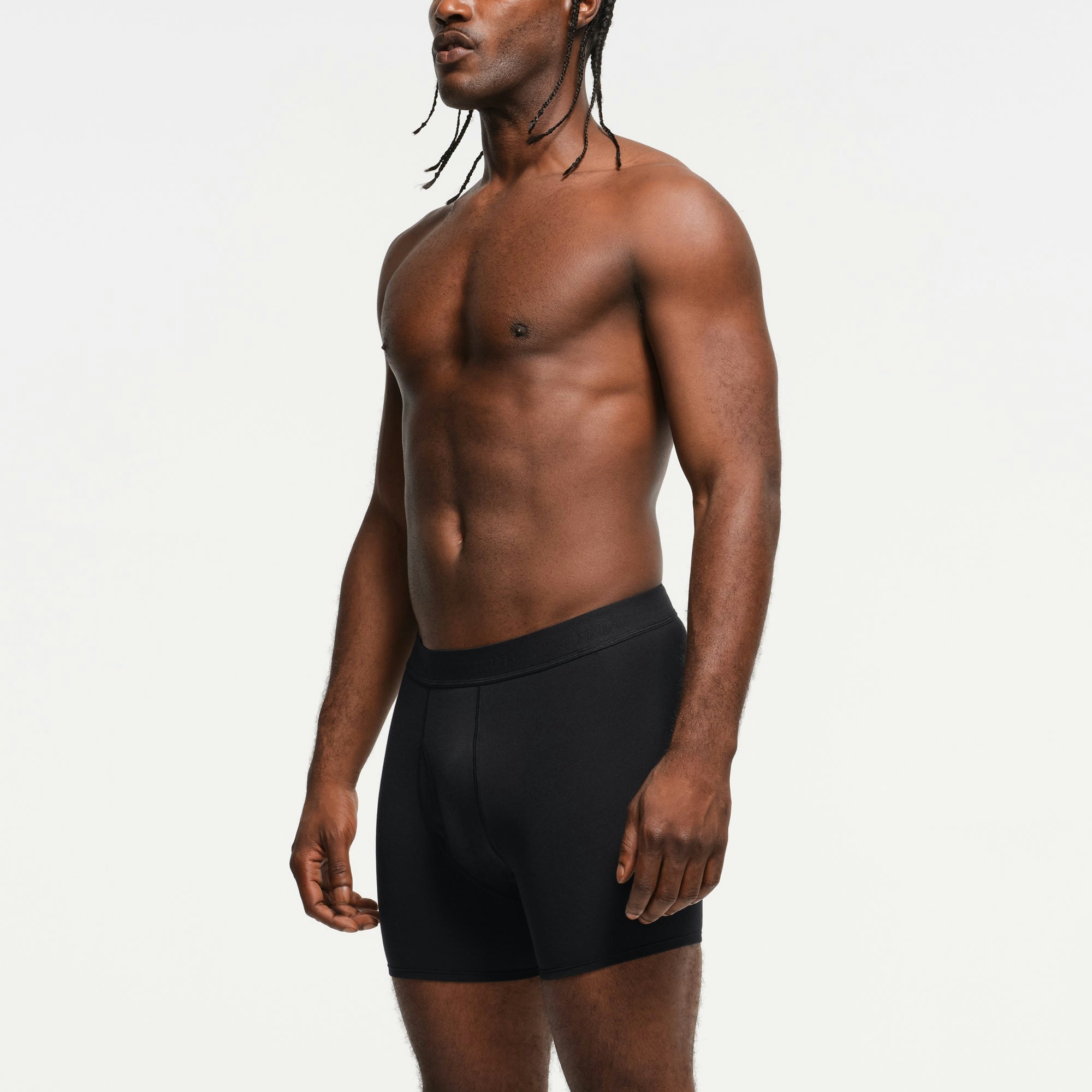 SKIMS BASICS MENS 100% COTTON BOXER BRIEF 3-PACK | OBSIDIAN ON A MODEL SIDE VIEW