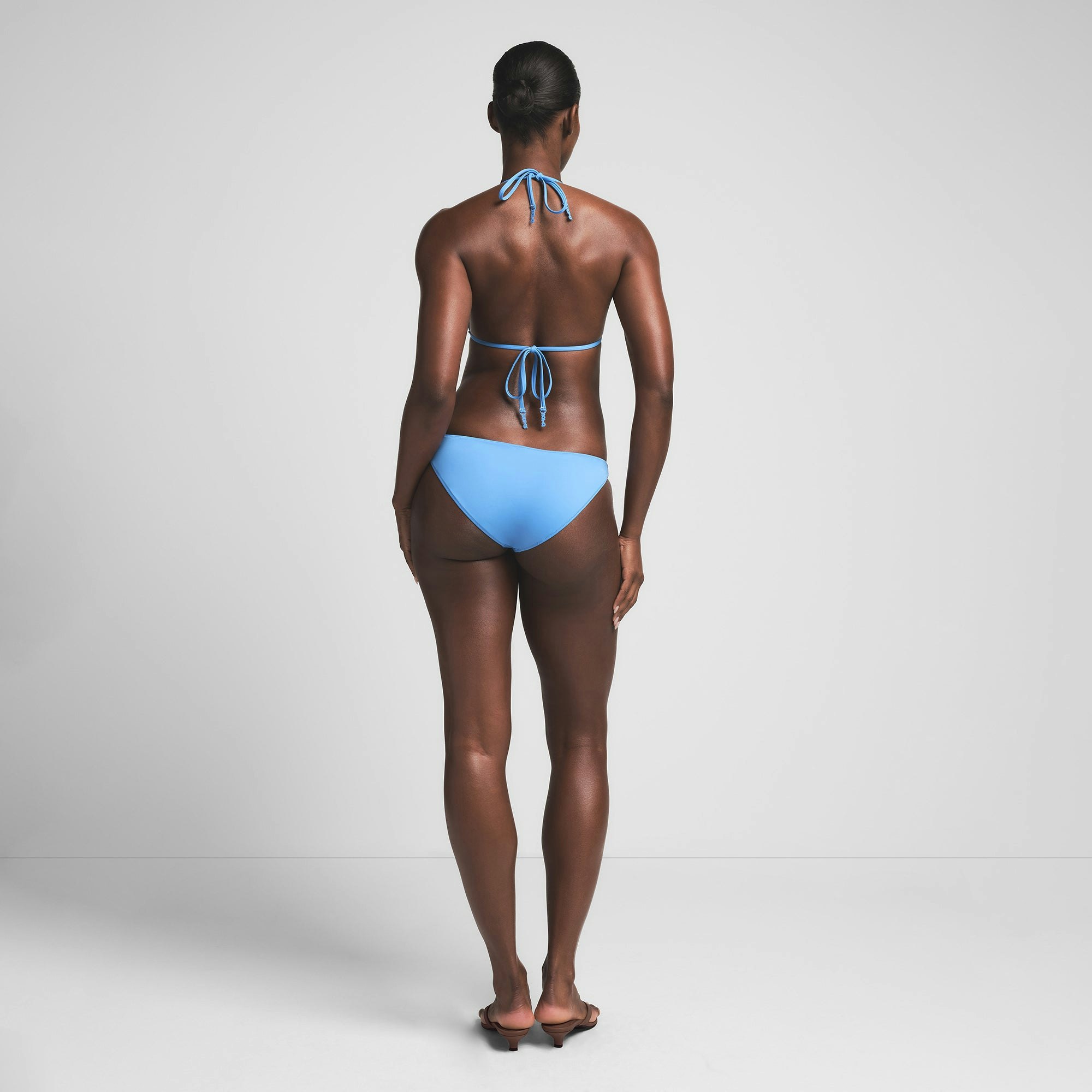 SIGNATURE SWIM LOGO BIKINI BOTTOM | TIDE ON A MODEL BACK VIEW | FOCUS: 0.0, 1.0, 0.9