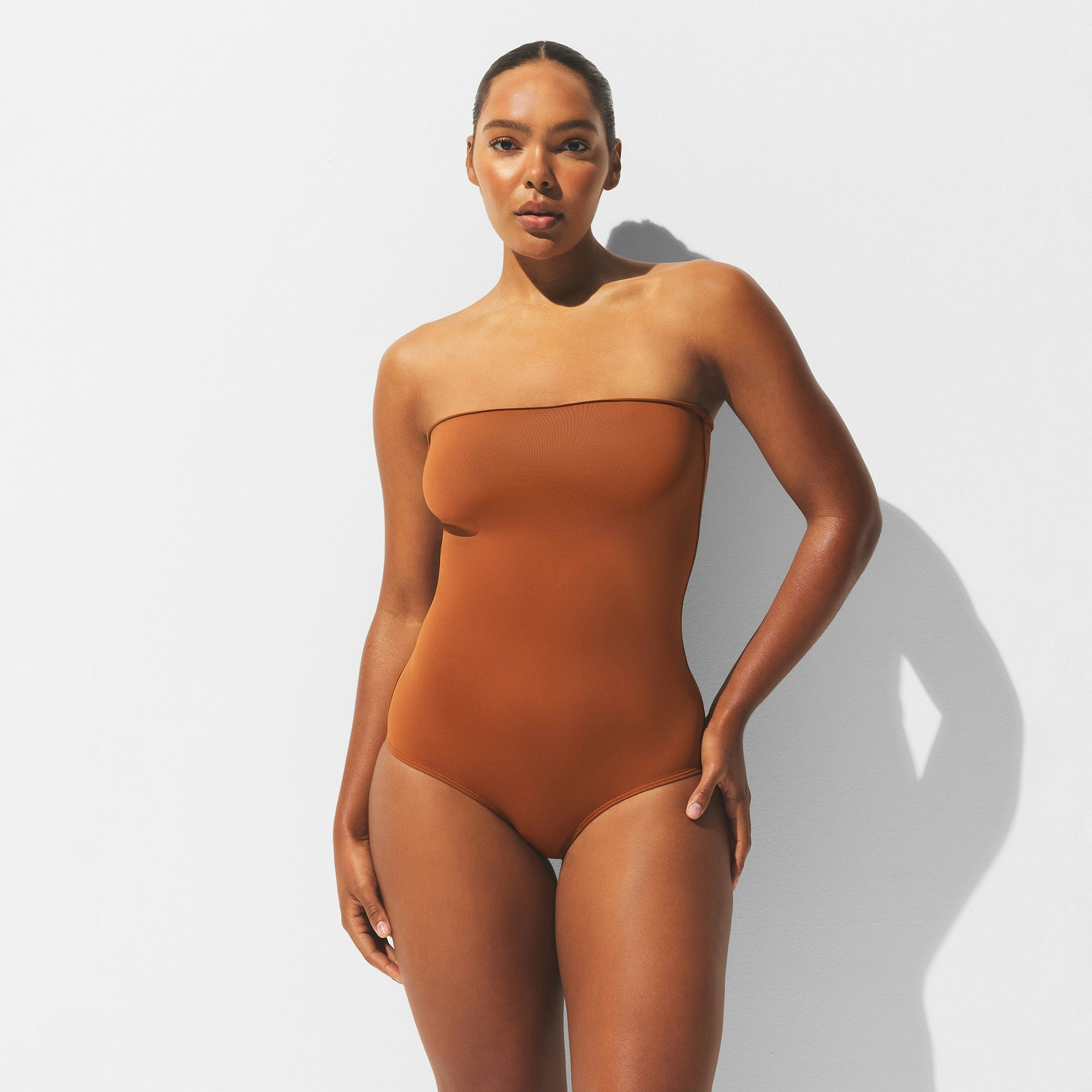 MINIMAL SWIM CONVERTIBLE BIKINI BOTTOM | BRONZE ON A MODEL FRONT VIEW | FOCUS: 0.0, 1.0, 0.9