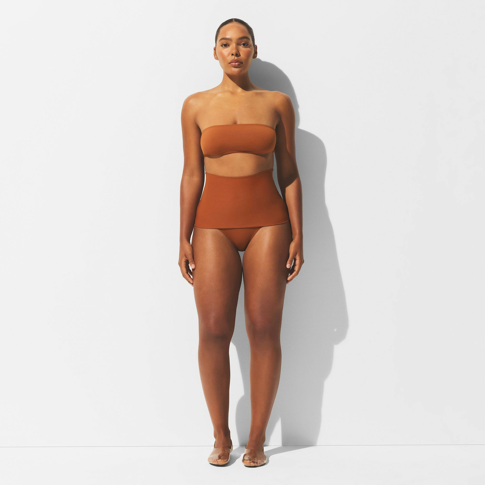 MINIMAL SWIM CONVERTIBLE BIKINI BOTTOM | BRONZE ON A MODEL FRONT VIEW | FOCUS: 0.0, 1.0, 0.9